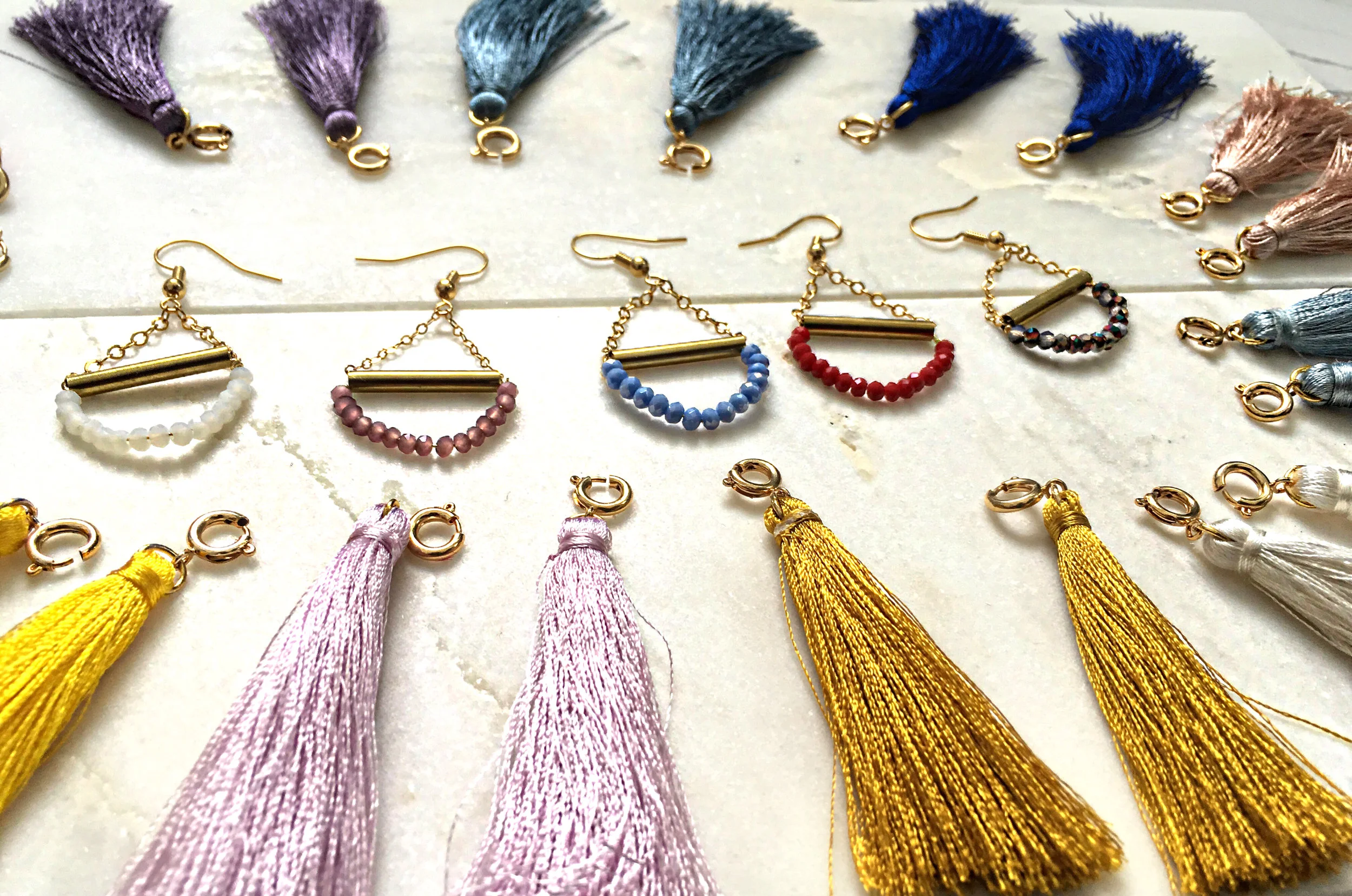 CARMEN $35 Multi-use detachable tassel earrings. Wear these in any color depending on your mood or occasion. First pair comes with your choice of tassel, extra tassels are $15 the pair