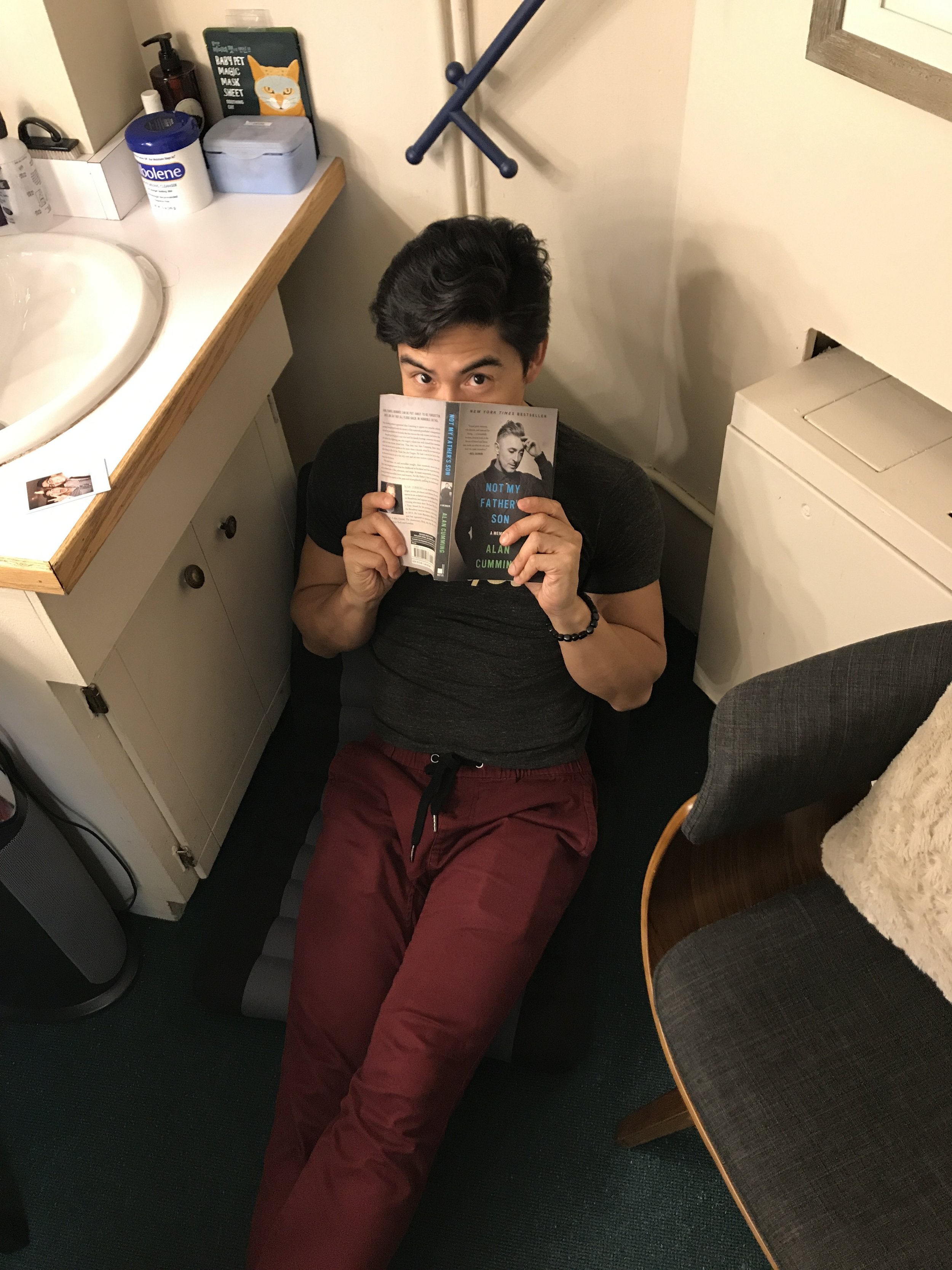 The handsome actor in his reading nook. 