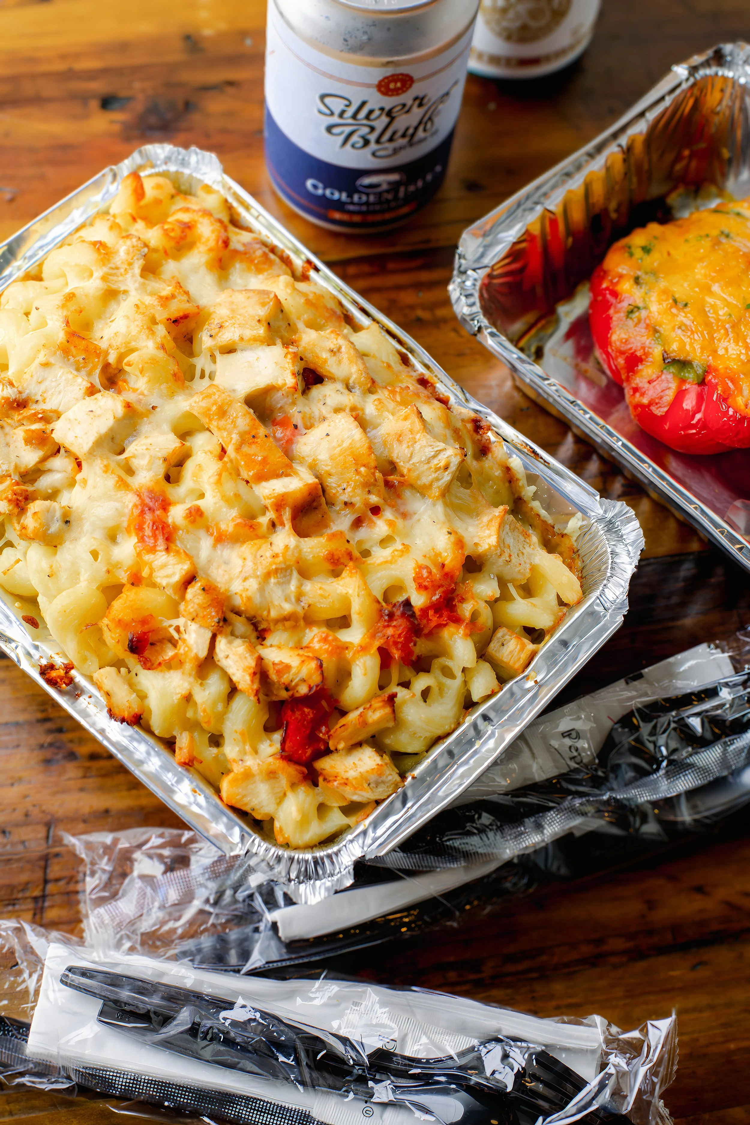 Baked macaroni dish in a catering tray, styled food brand photography