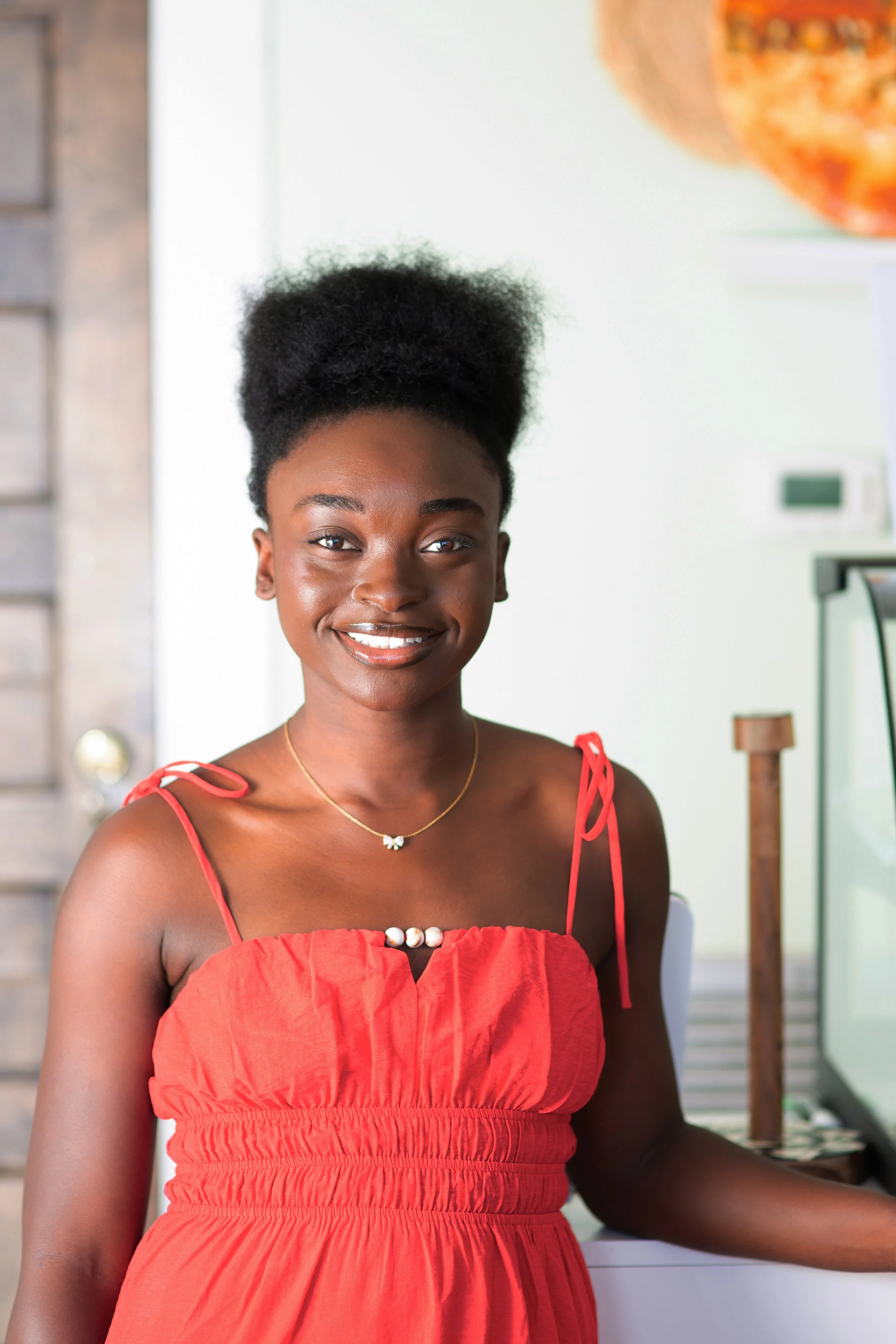 Faith King stands at her bakery stand, Newcastle Bakery, inside of the Brown Butter Shoppe in Downtown Brunswick, GA