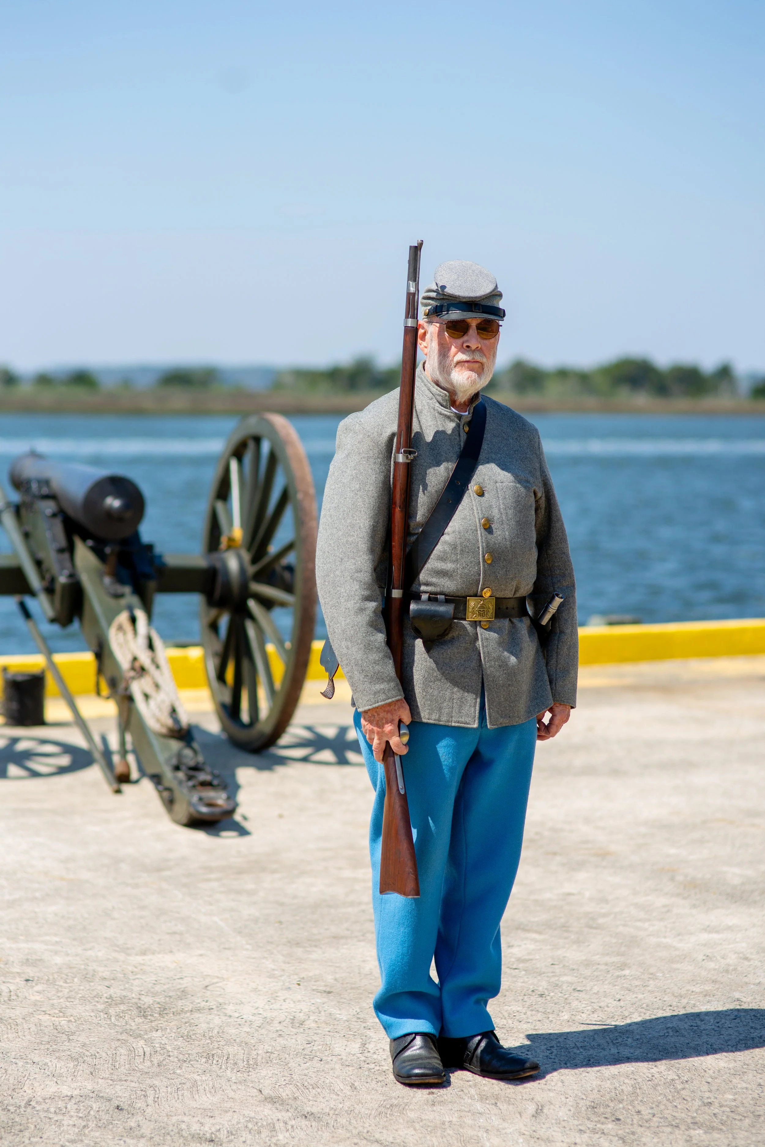 A reinactment confederate soldier stands at shoulder arms with his muskeet at the Mary Ross Waterfront Park in Brunswick, GA for the 2026 Coastfest event