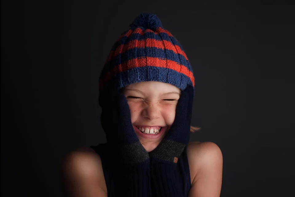 Boy laughing studio