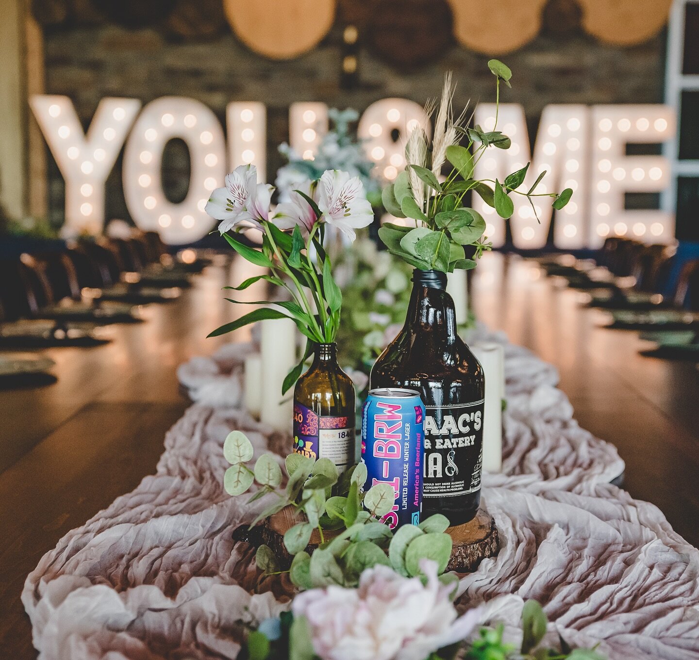Some of the best centerpieces we&rsquo;ve seen come from collections of peoples past combined with traditional decor. As an event space within a brewery, we&rsquo;re always thrilled to see the stories of couples affinity for beers and the places they