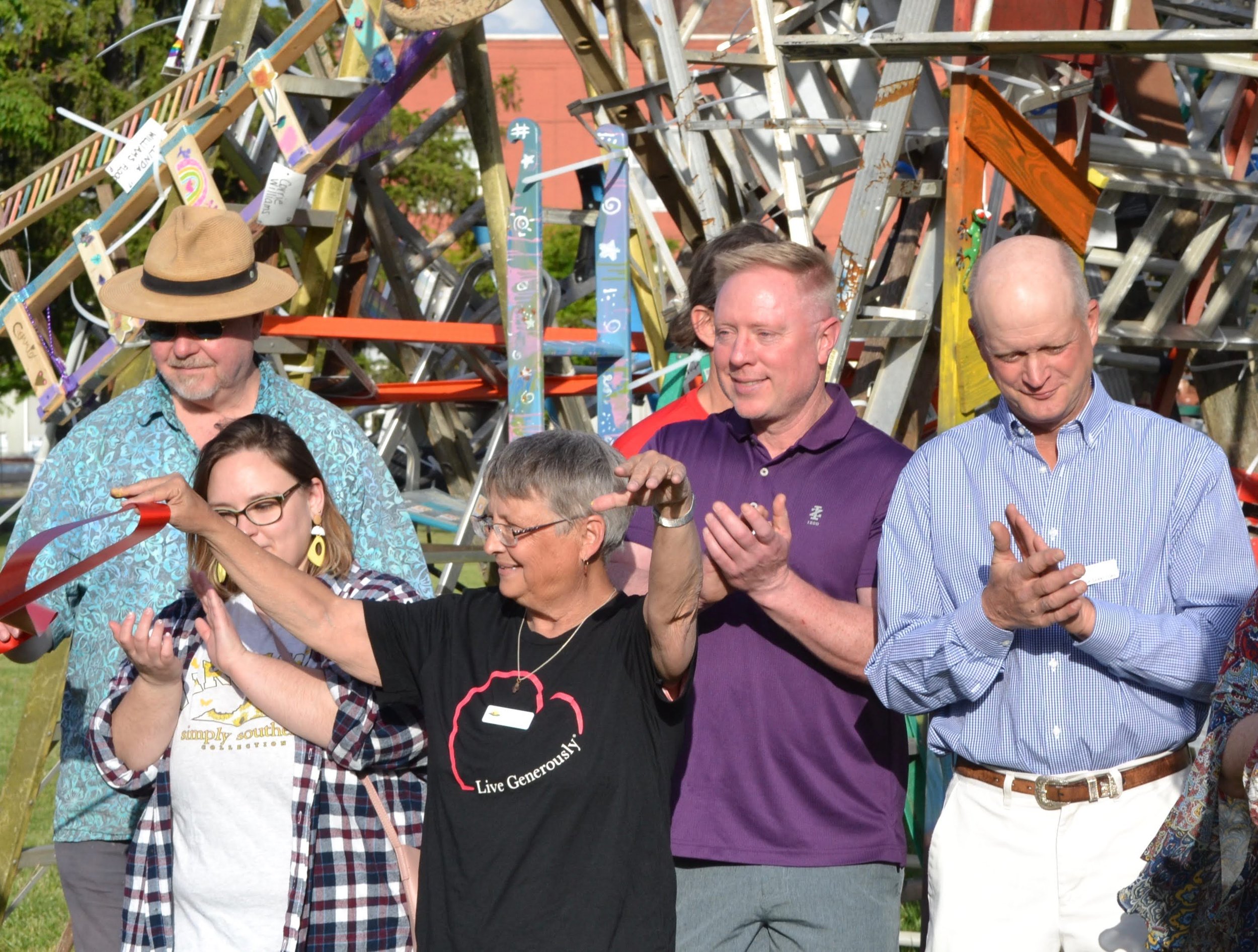 Board members celebrate the cutting of the ribbon