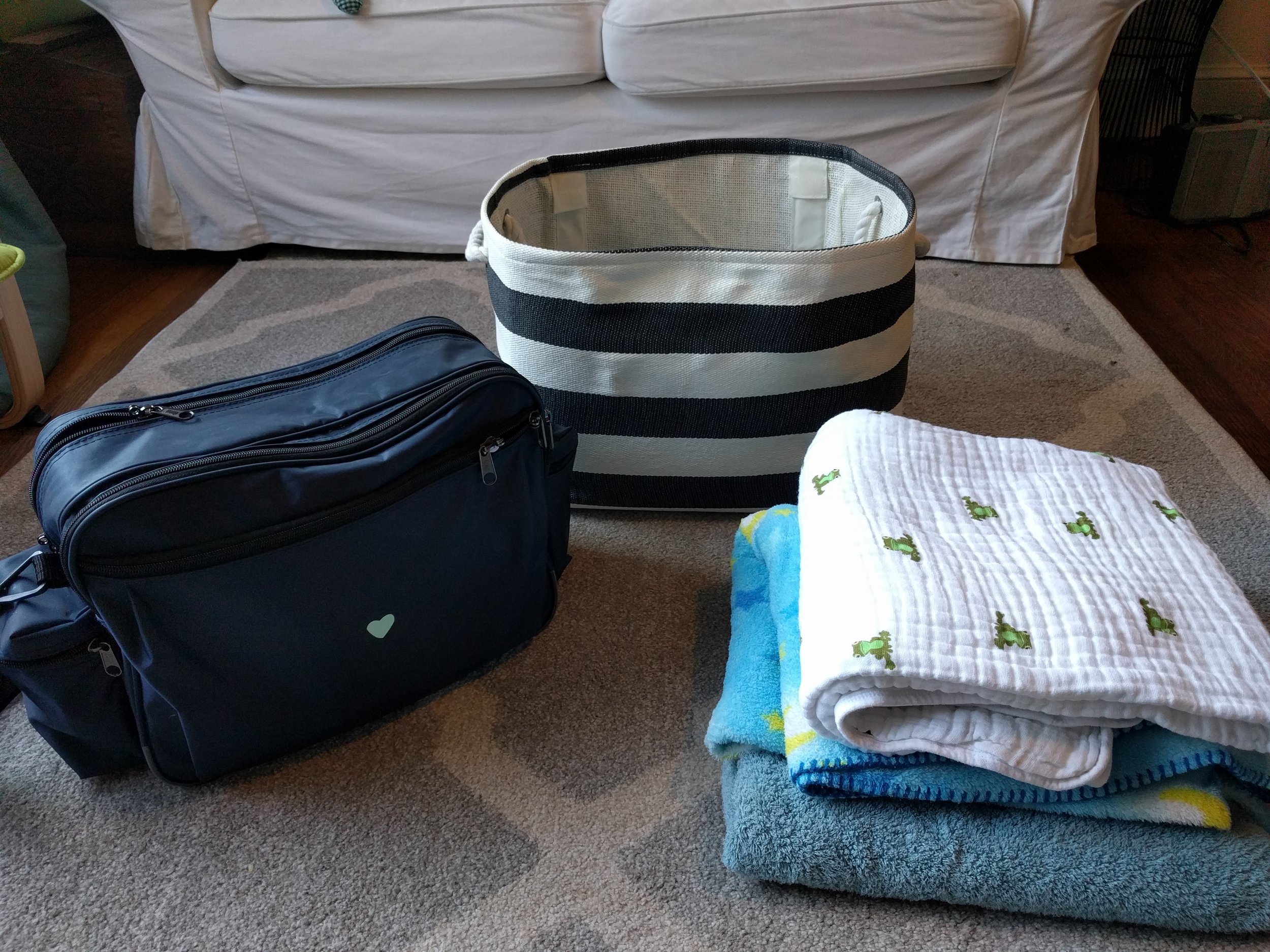 From left to right: Medical bag, basket for transportation of cats and smaller dogs, some of the blankets used for covering pets during transportation