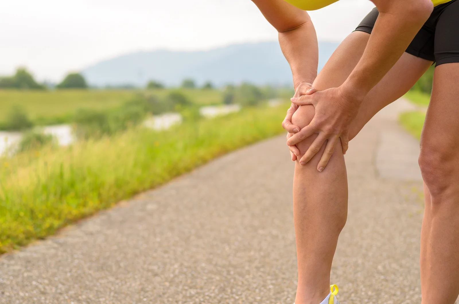 bigstock-Woman-Holding-Her-Injured-Knee-133898393.jpg
