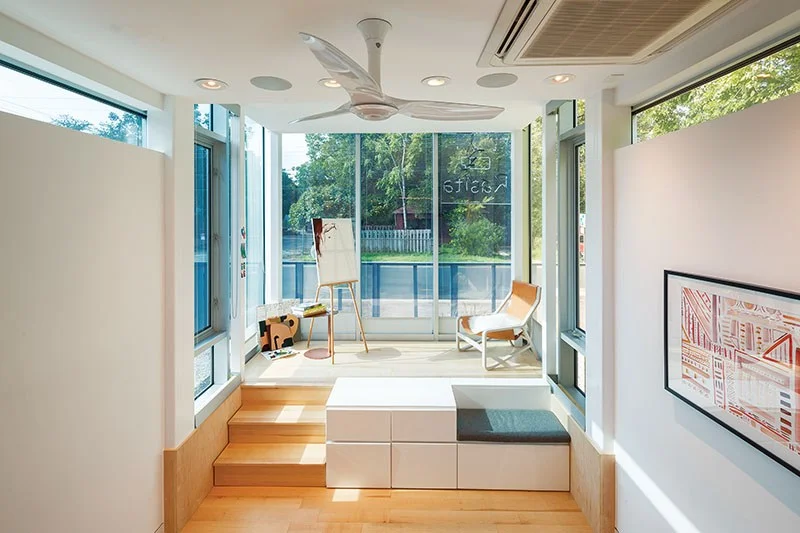 The lifted glass front of the Kasita is called “the Cube.” The company describes it as “a workspace, lounge area, or a place to fit in a little morning yoga.”