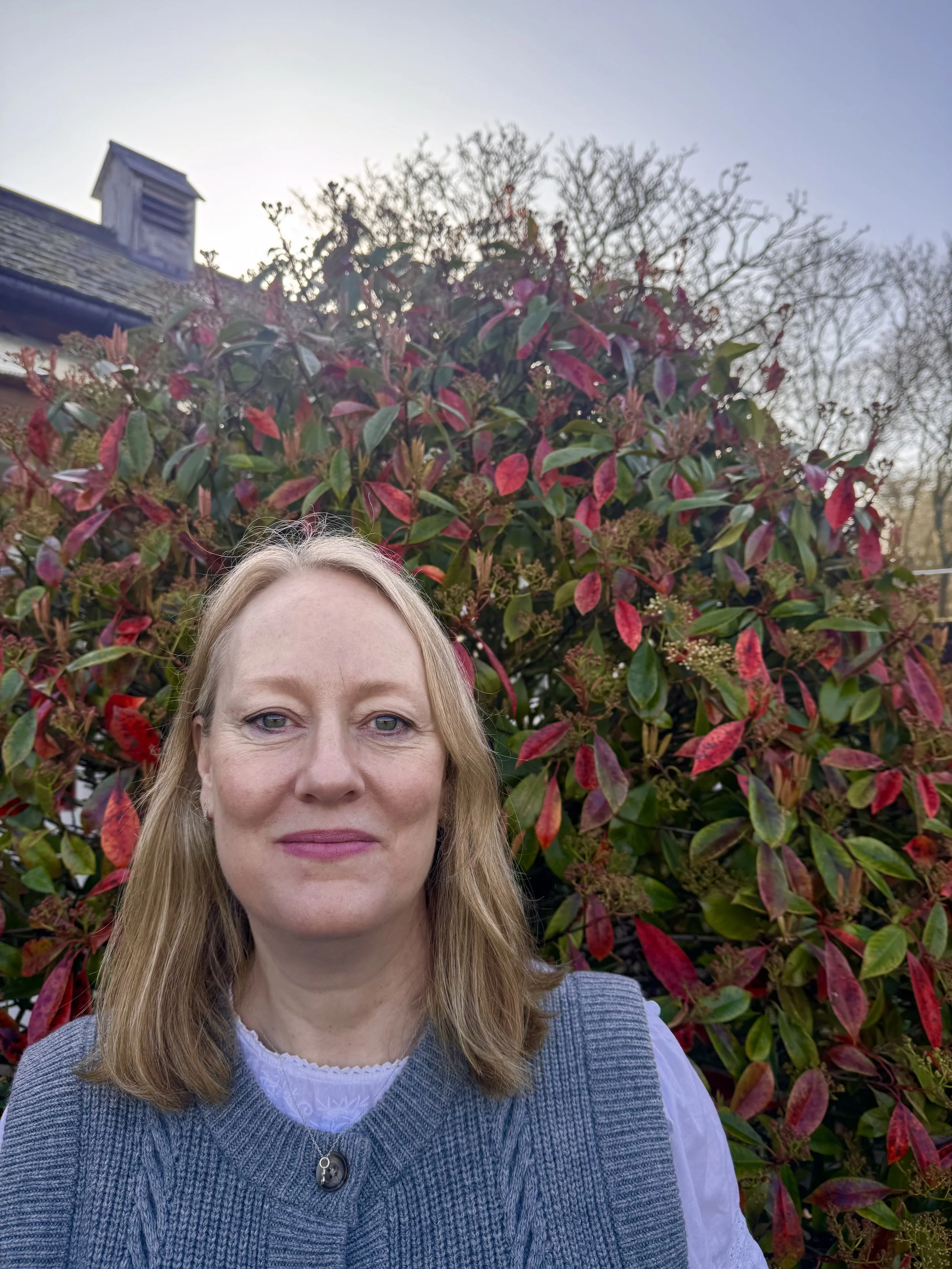Stella, our kitchen manager, smiling in the garden at our kitchen in Wimbledon.
