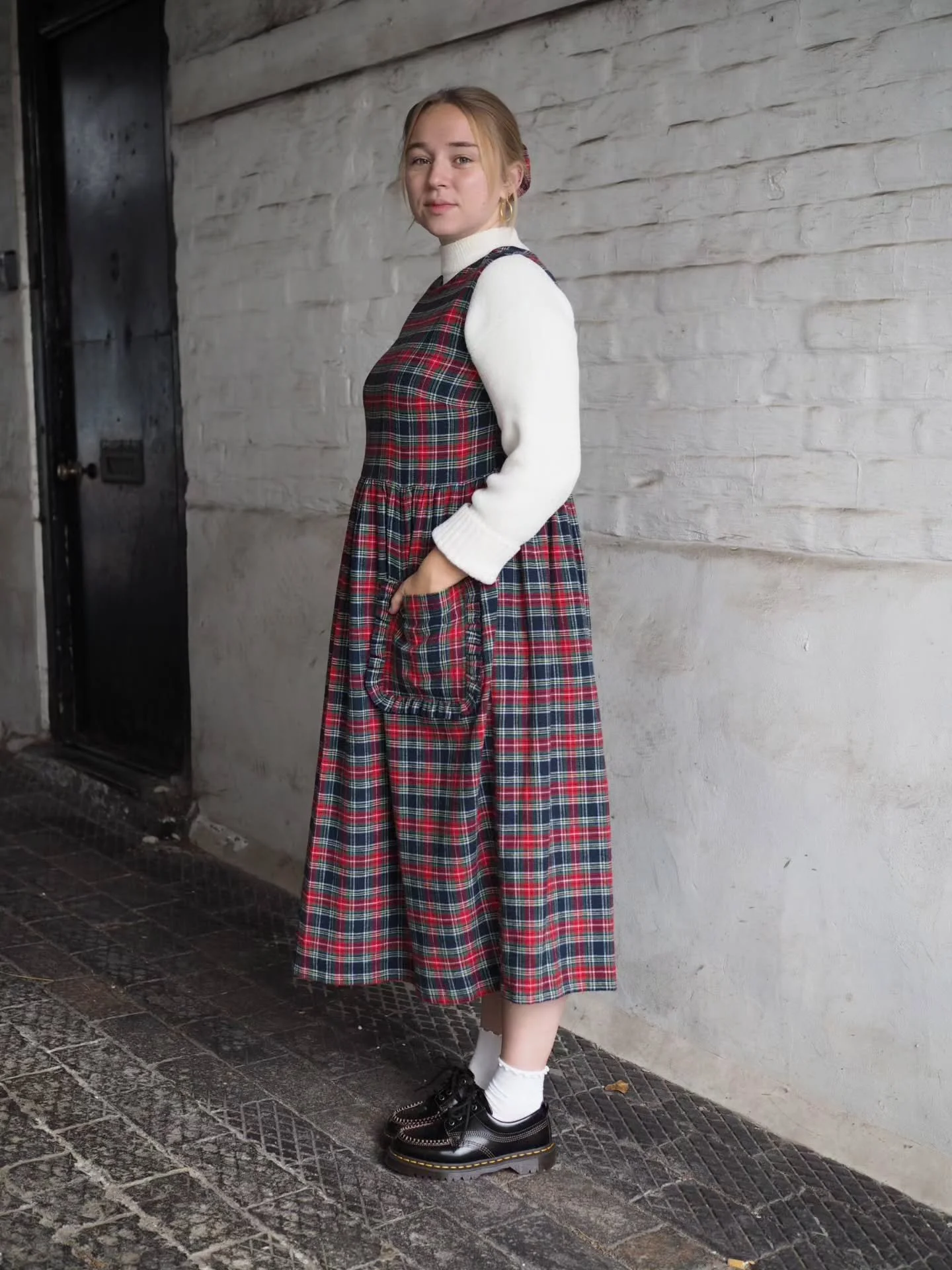 We have designed everything in our party season capsule collection to be versatile enough to wear lots of different ways with the clothes you already own. Here's Amy showing us a few different options with our Ruffle Pocket Millie dress in Tartan bru