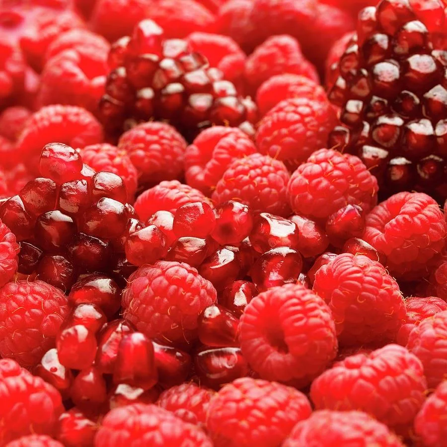 close-up-of-fresh-raspberries-and-pomegranate-andrew-bret-wallis.jpg