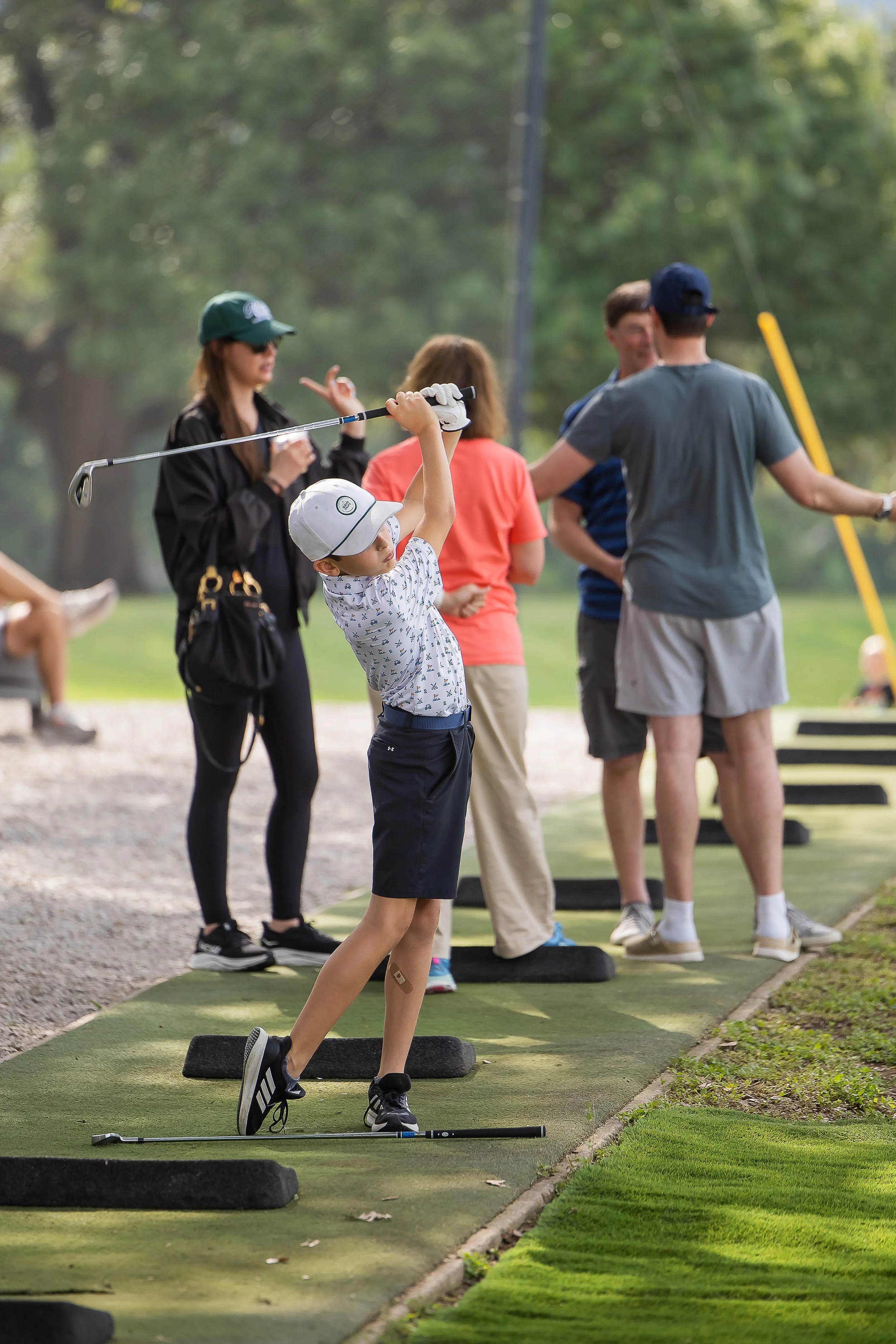 Kid on driving range