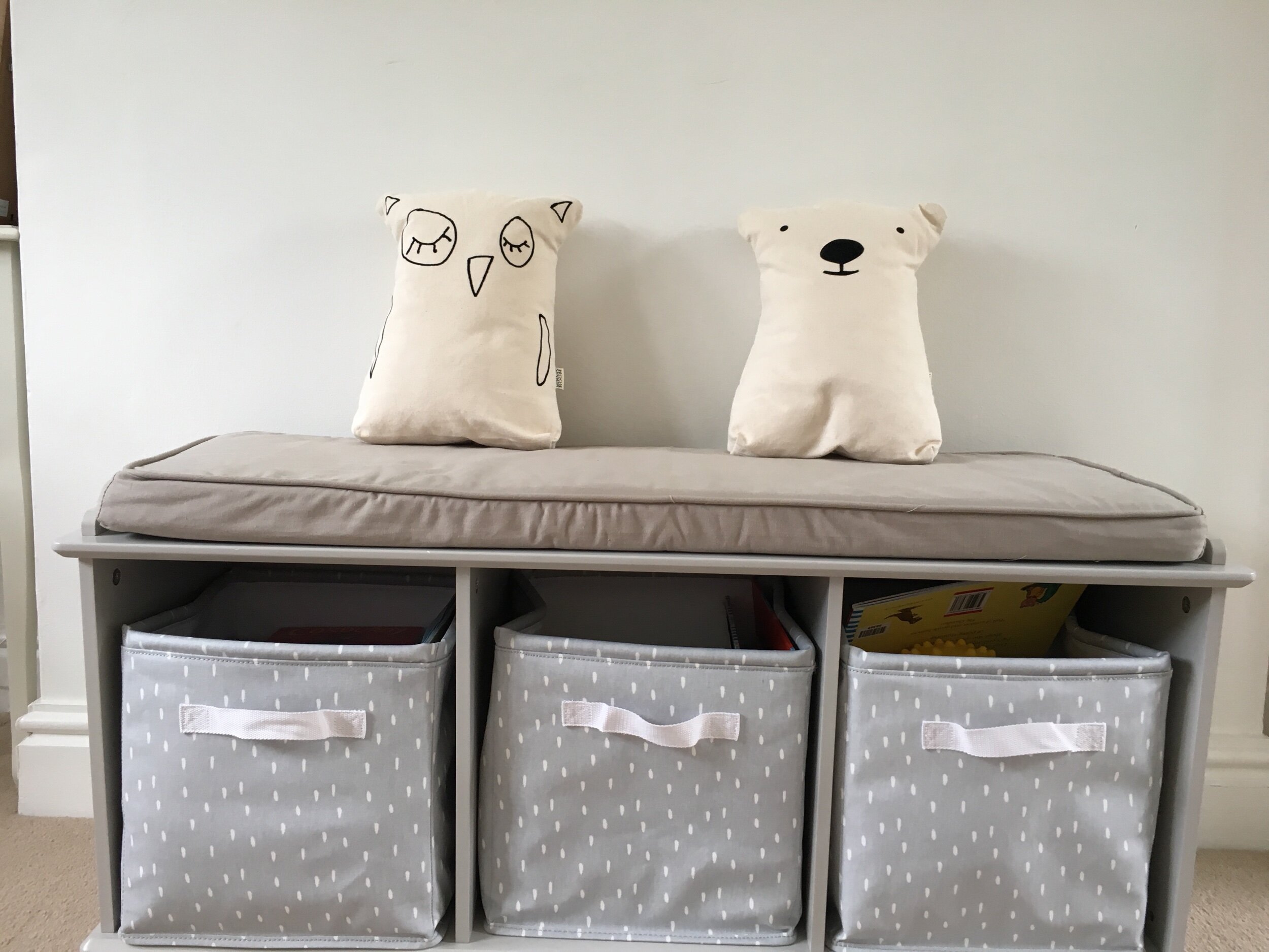 How can you make a storage area look better? Invest in some beautiful woodland theme cushions to put on top of it! We love this owl and bear ensemble!