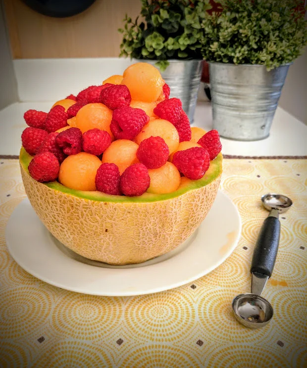 I decided to pile all my fruit into one side of the melon rind, but you can use both sides if you want! The tool you see on the right is a melon-baller. This one has a small and large end.