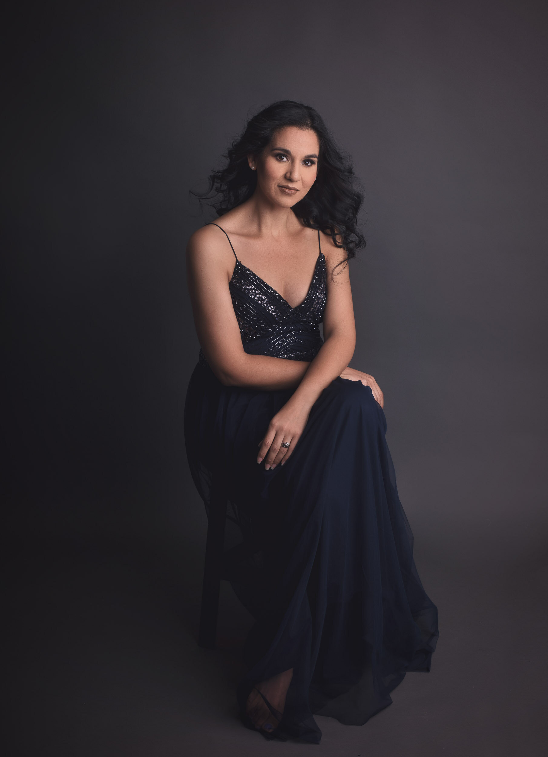 beautiful glamour portrait pose in gorgeous navy blue gown shot at Ana Lanier Portrait Studio in Dallas, TX
