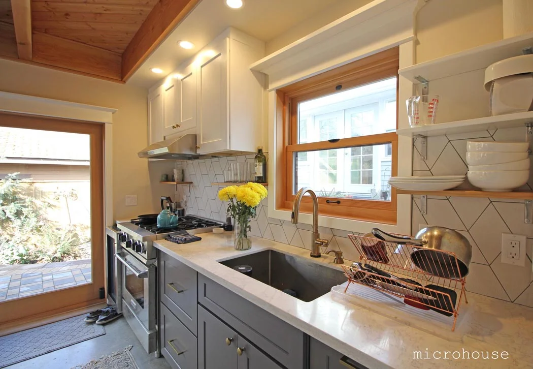The kitchen is located along one wall is both compact and simple.