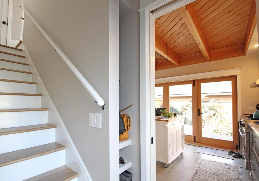 A pocket door located at the bottom of the stairs allows for the two floors to be used independently.