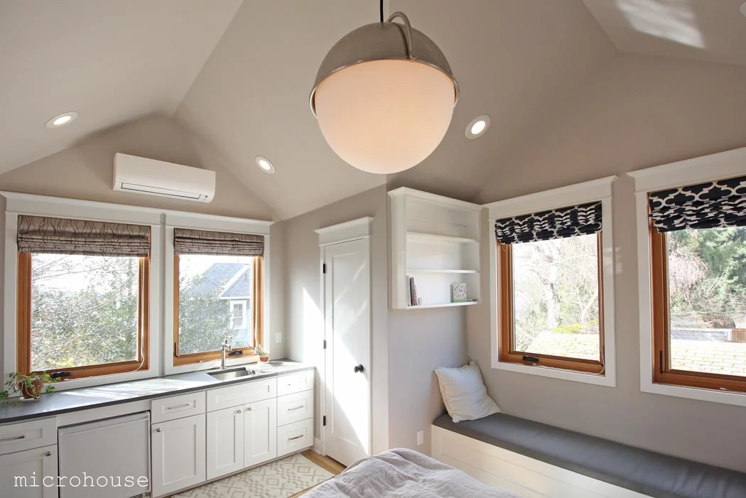 The city of Seattle limits both the eave and ridge height of cottages allowing greater height for a gable roof which we took advantage of to good effect. 