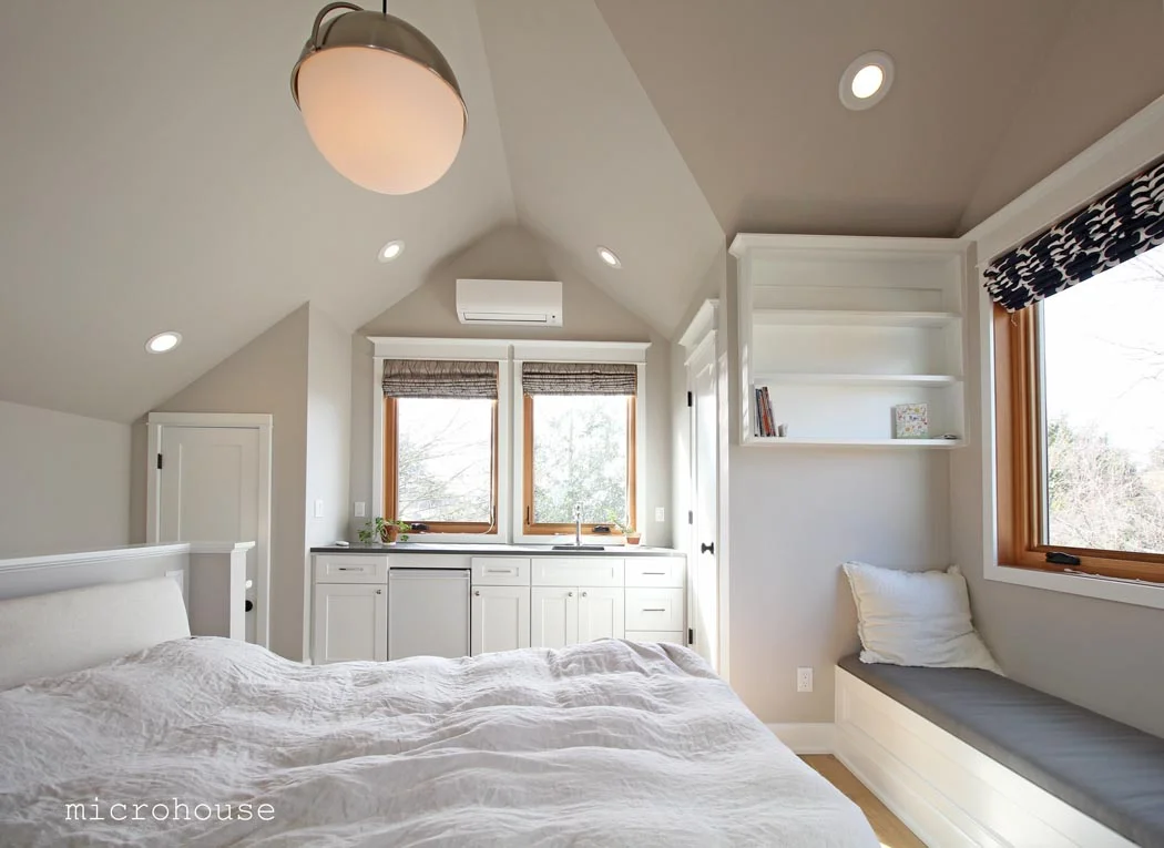The master suite features vaulted ceilings and abundant light. A kitchenette allows this room to be used separately from the first floor.