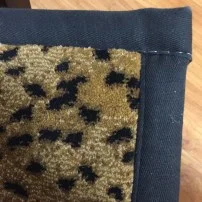 Carpet with wide binding and square corner