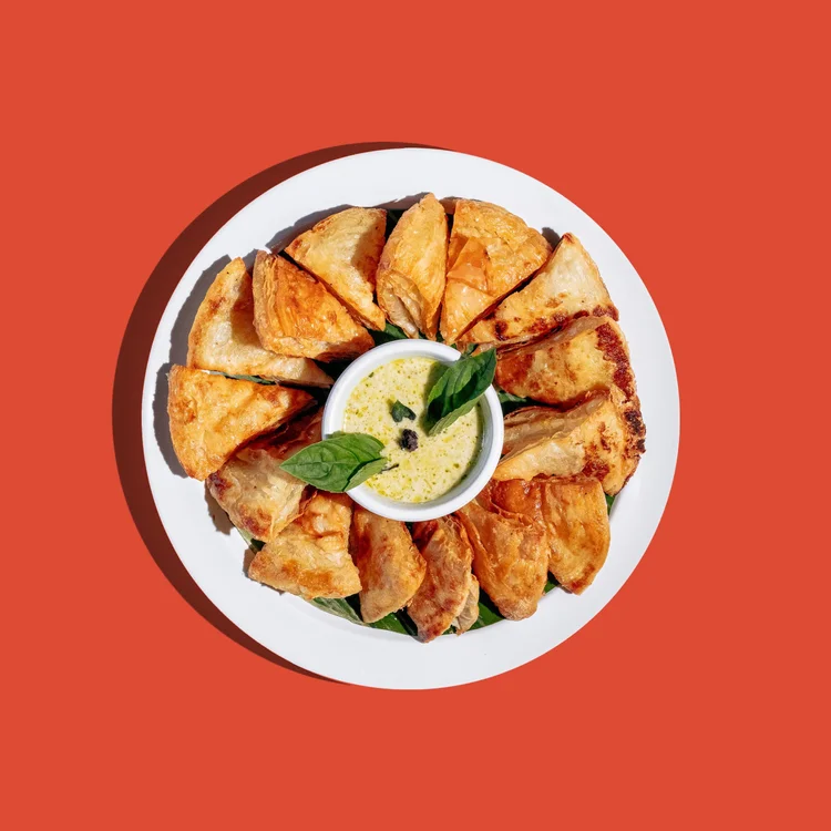 Roti served with a bowl of green curry for dipping