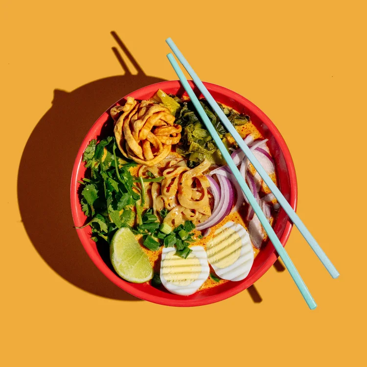 Khao soi curry noodles with egg, lime and pickled greens