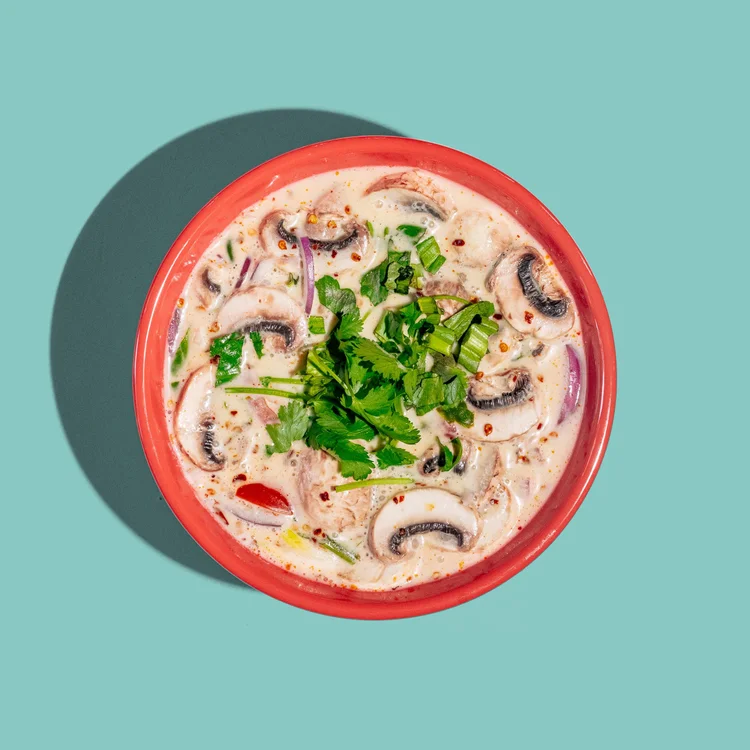 Tom kha coconut soup with mushrooms and herbs