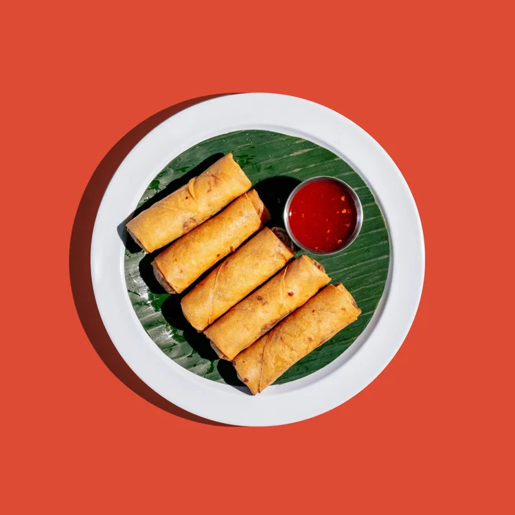 Crispy veggie egg rolls with sweet chili sauce