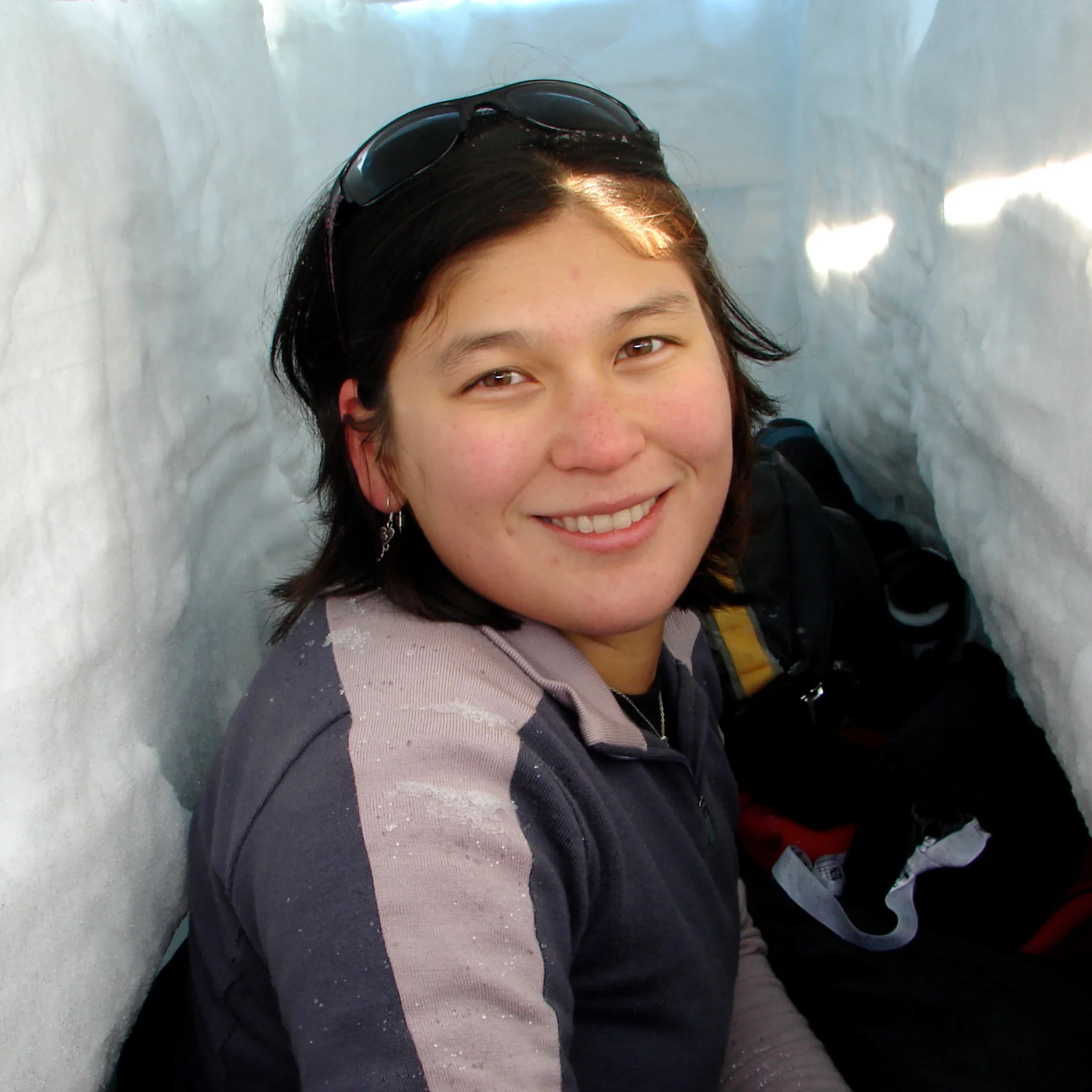 Getting ready to go to sleep in my snow trench I dug during survival training in Antarctica.