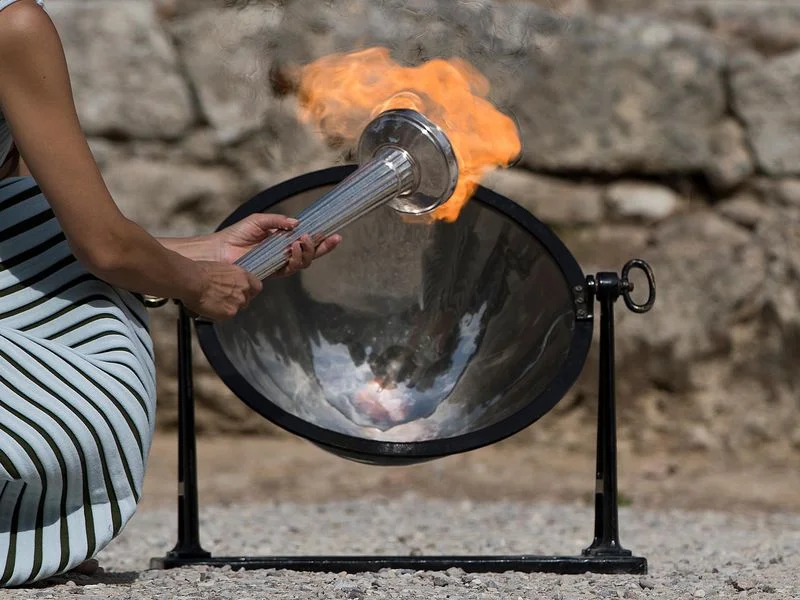 The Olympic Flame was lit from the sun’s rays using a parabolic mirror, during the final dress rehearsal for the lighting ceremony at Ancient Olympia, in southwestern Greece, on Monday, Oct. 23, 2017. (AP)