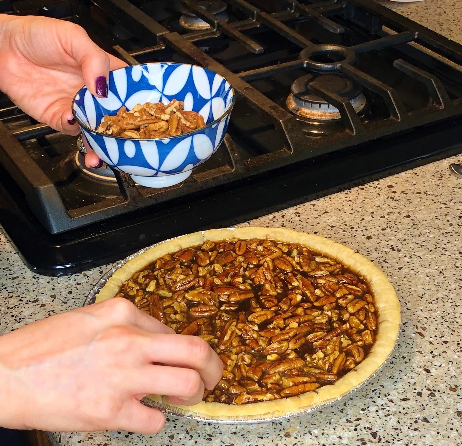 Putting on Pecans.JPG
