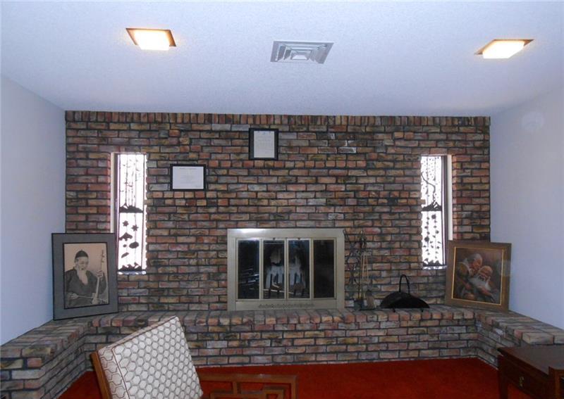 Wall to Wall Brick Fireplace Pre Remodel