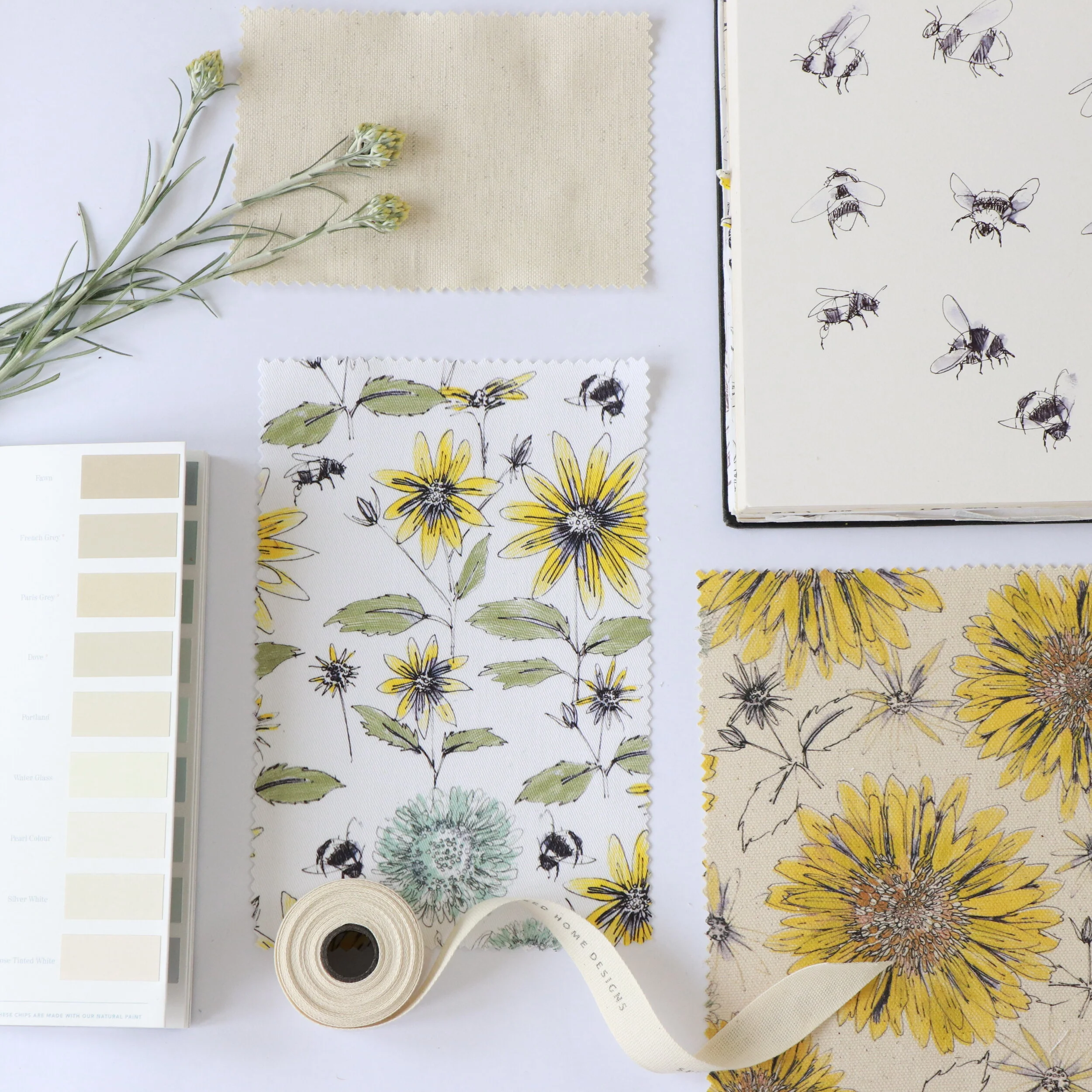 Bumble bee and organic sunflower fabric flat lay Cornwall UK