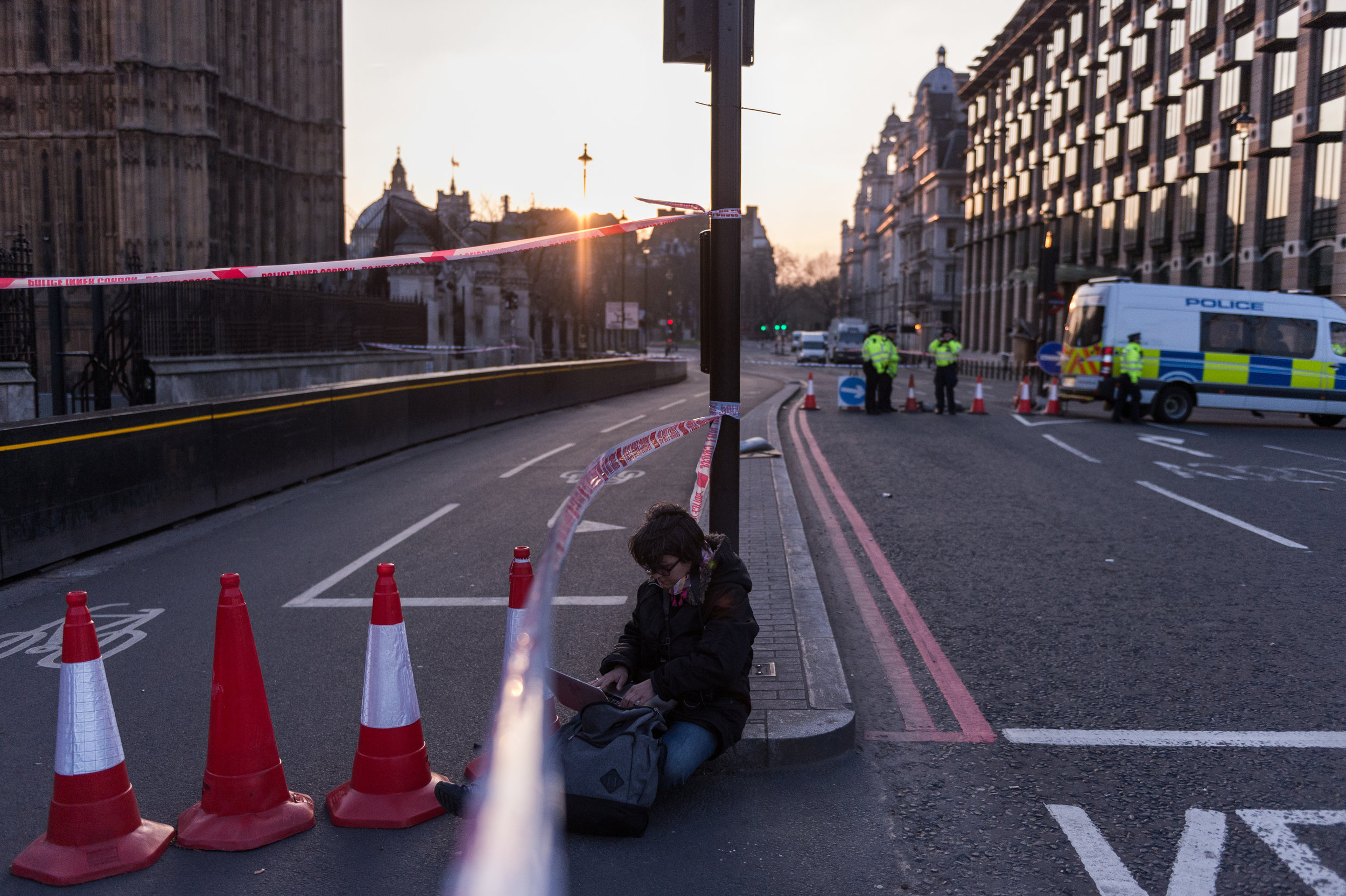  A journalist works under the police cordon surrounding Parliament Square after the incident.&nbsp; 