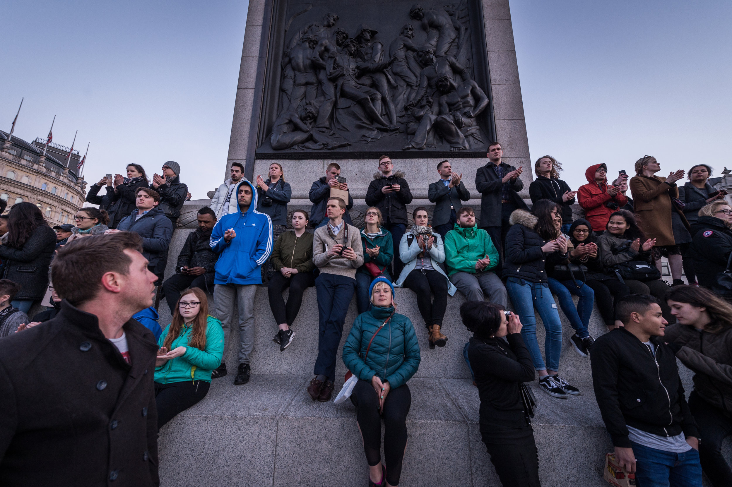  Onlookers climb Nelson's column to get a better view of the proceedings.&nbsp; 