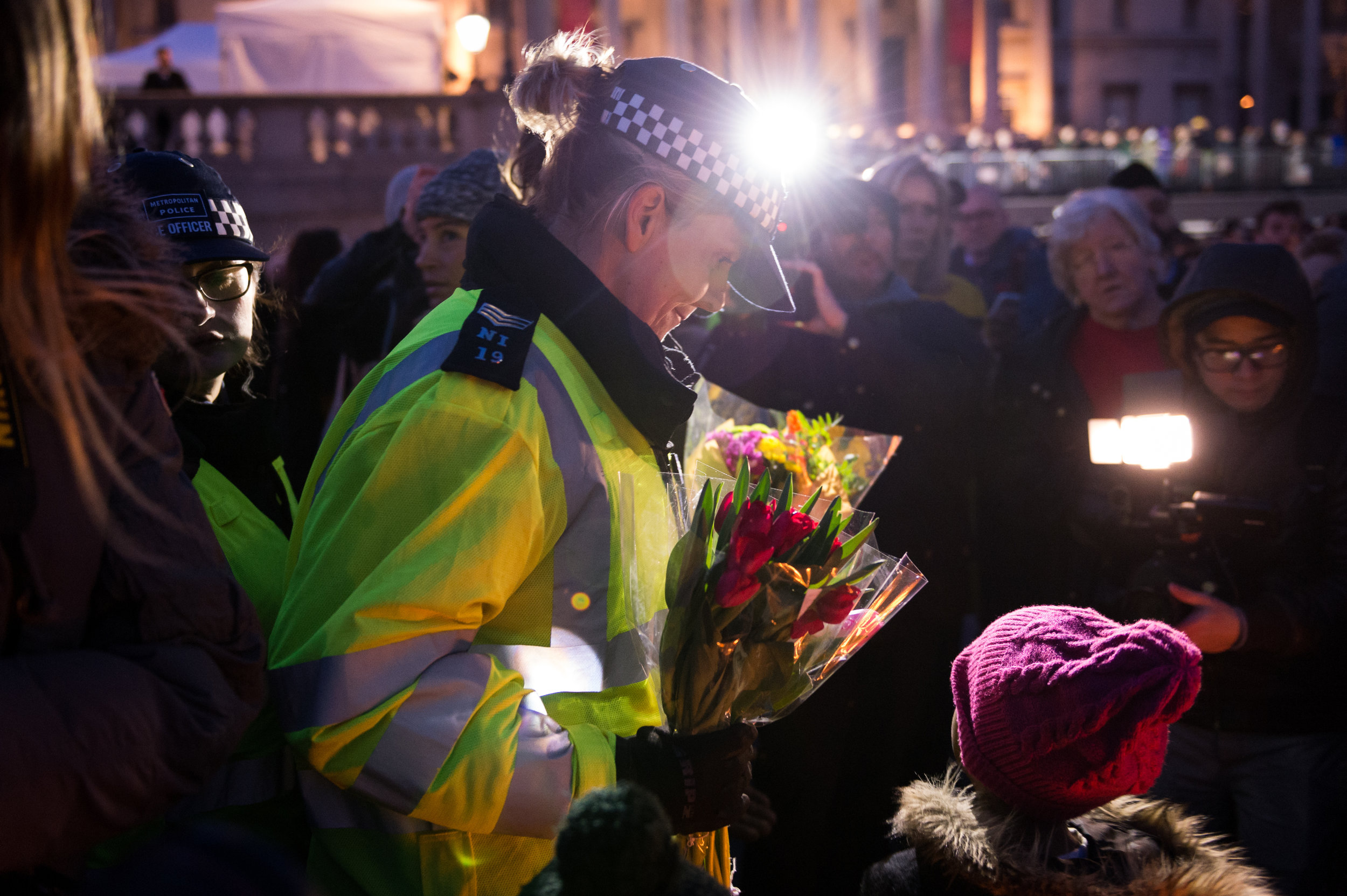  A police officer lays a floral tribute. 