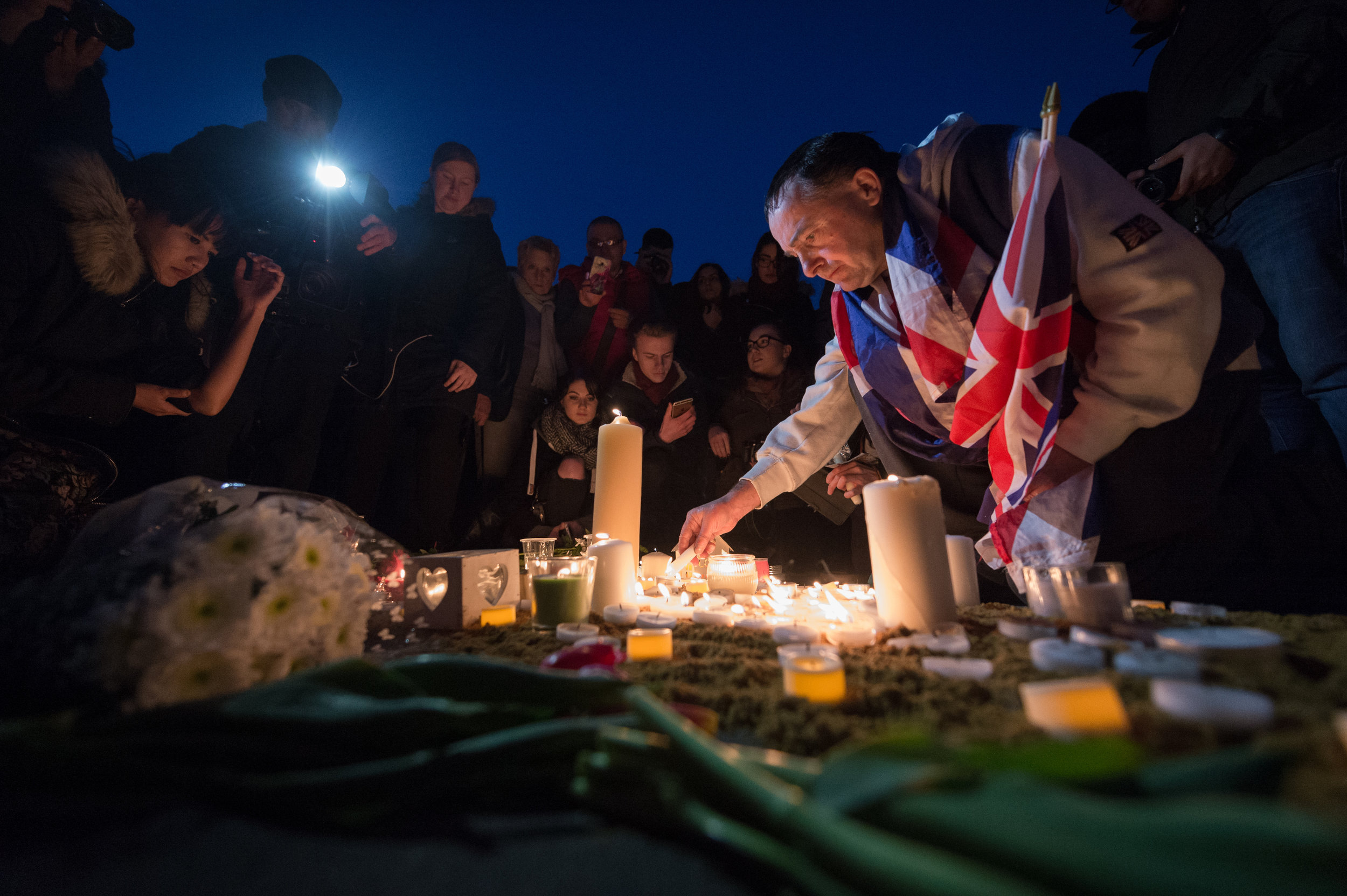  Well-wishers light candles and leave tributes to the victims of the attack. 