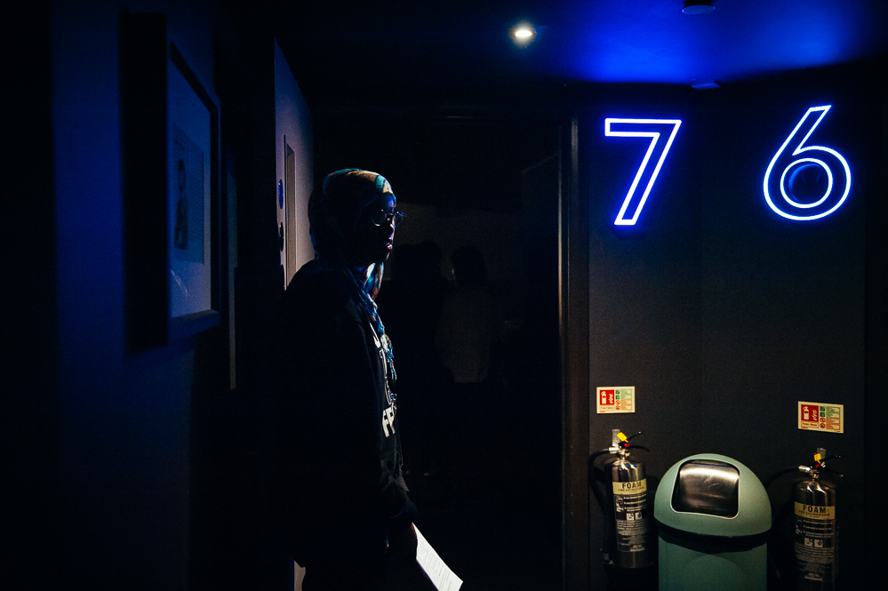  An usher waits outside a cinema screen.  - Picturehouse Central, London.  