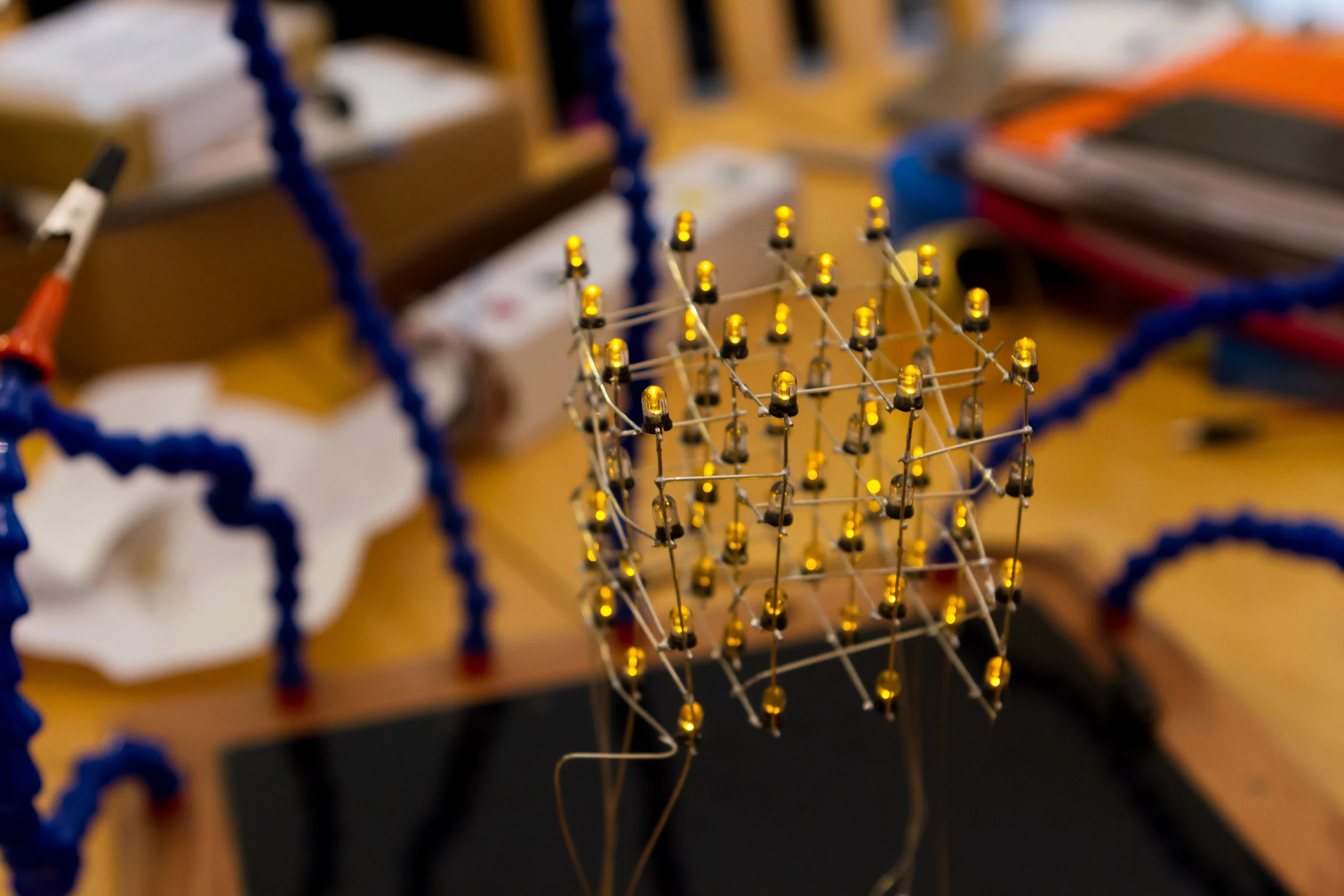 Assembled LED cube looking a little rough around the edges because this picture was taken after a weekend at the Hackaday Superconference
