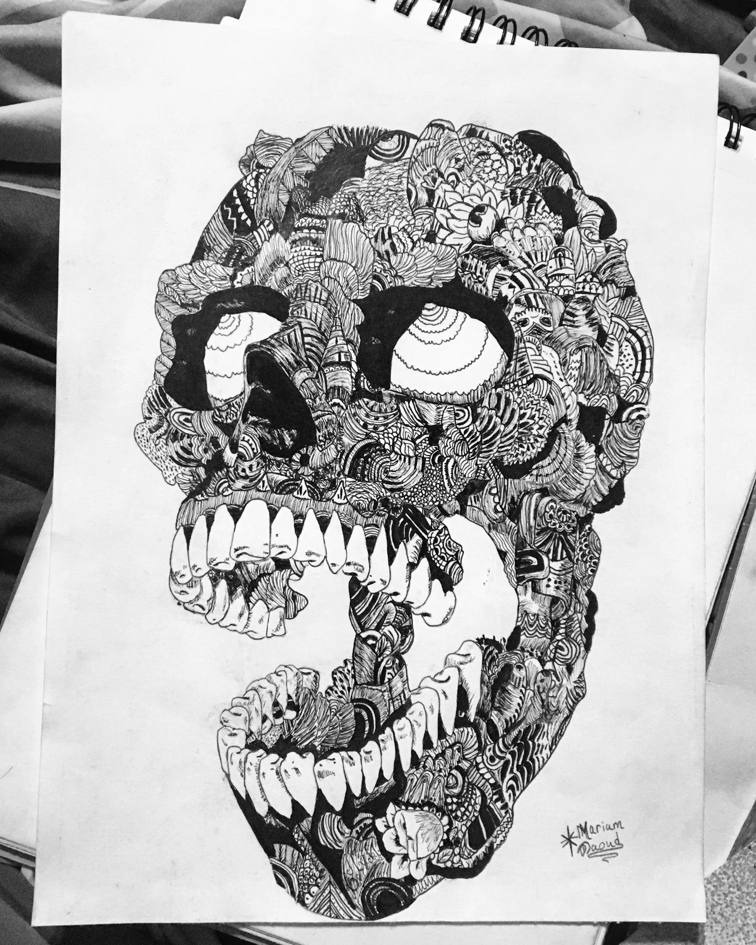 I was inspired by the Latin Day of the Dead holiday and their sugar skulls, but I took a more dark approach to it and I used a zentangle technique. The day of the dead art intrigued me and I gave it a try because it’s very complex yet it comes together to create one image; for example, the skull.