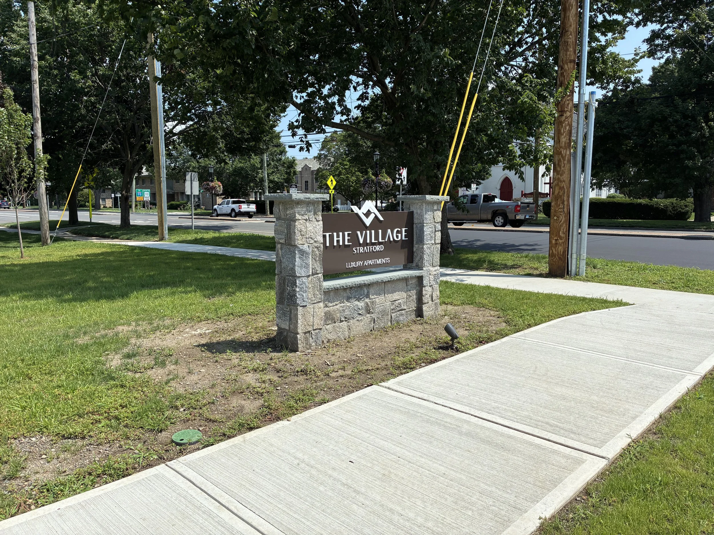 A GLOWUP for the area around the sign for Luxury Apartments in Stratford. August 2026