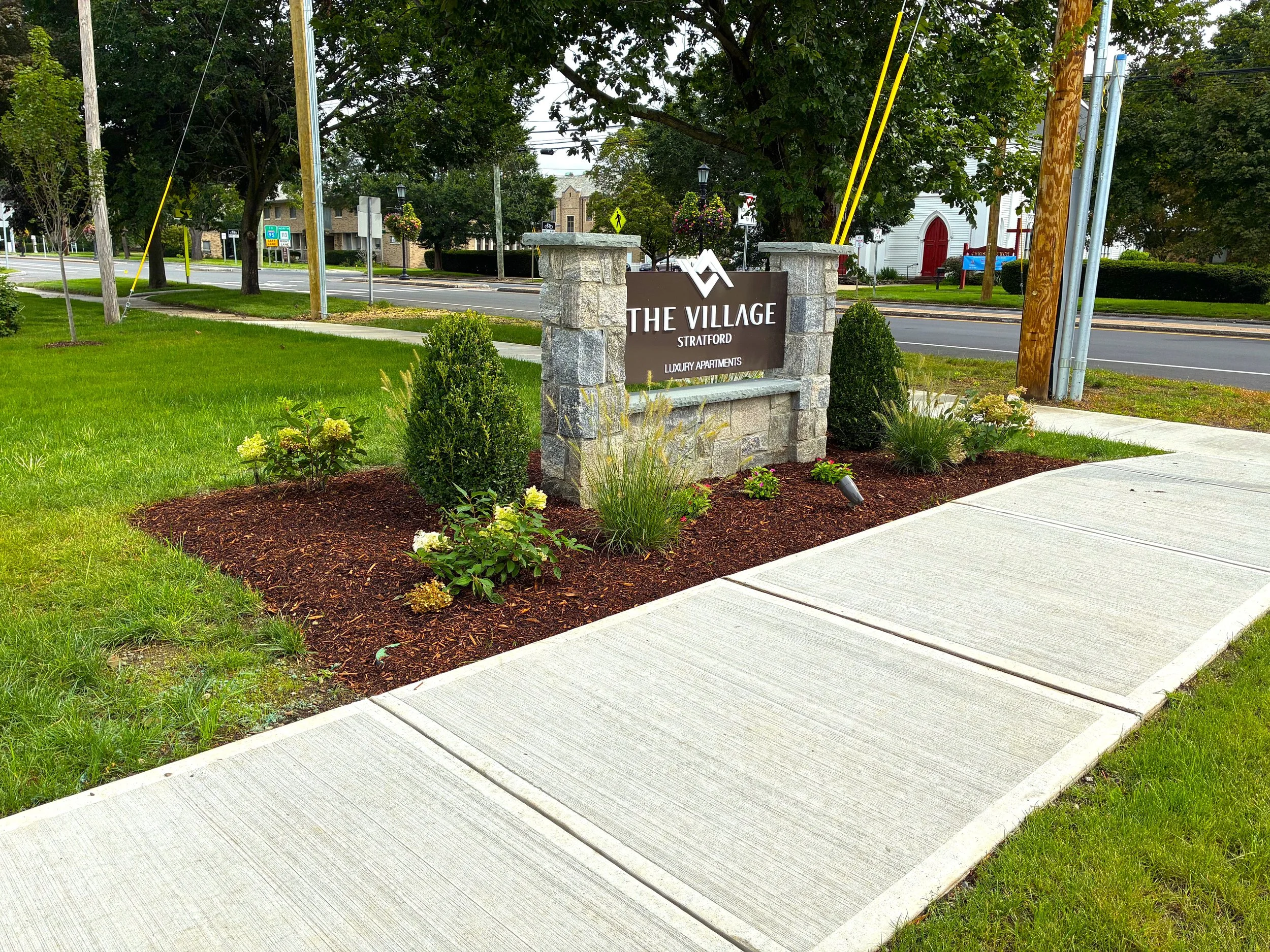A GLOWUP for the area around the sign for Luxury Apartments in Stratford. August 2026
