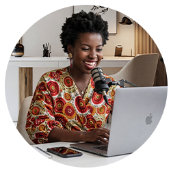 An executive recording an interview using a plug-and-play USB microphone setup curated by The Expert Bookers.