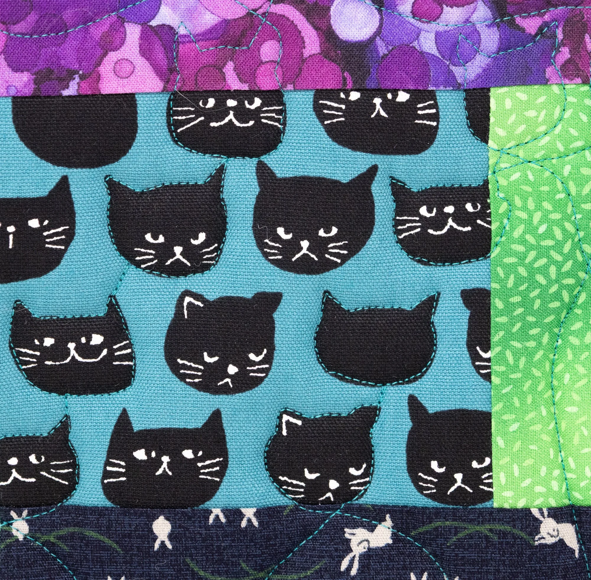 Black cats turquoise 6 front detail 2000px.jpg