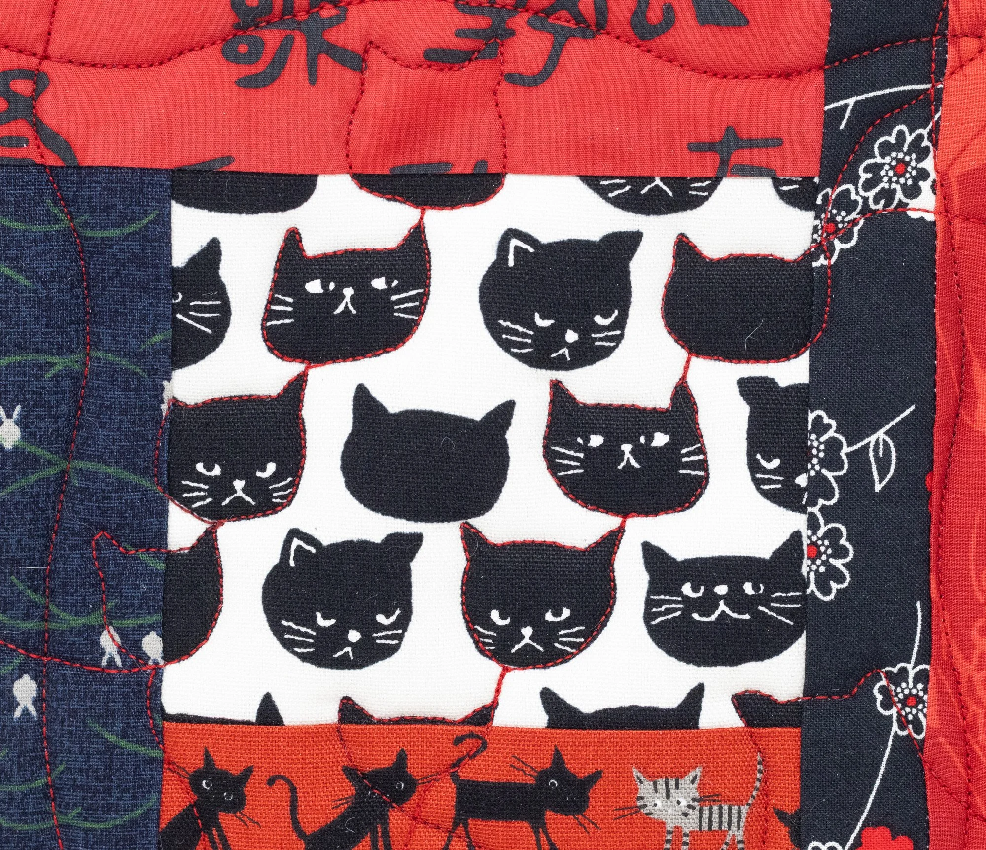 black cats on white w red 3 detail front 2000px.jpg