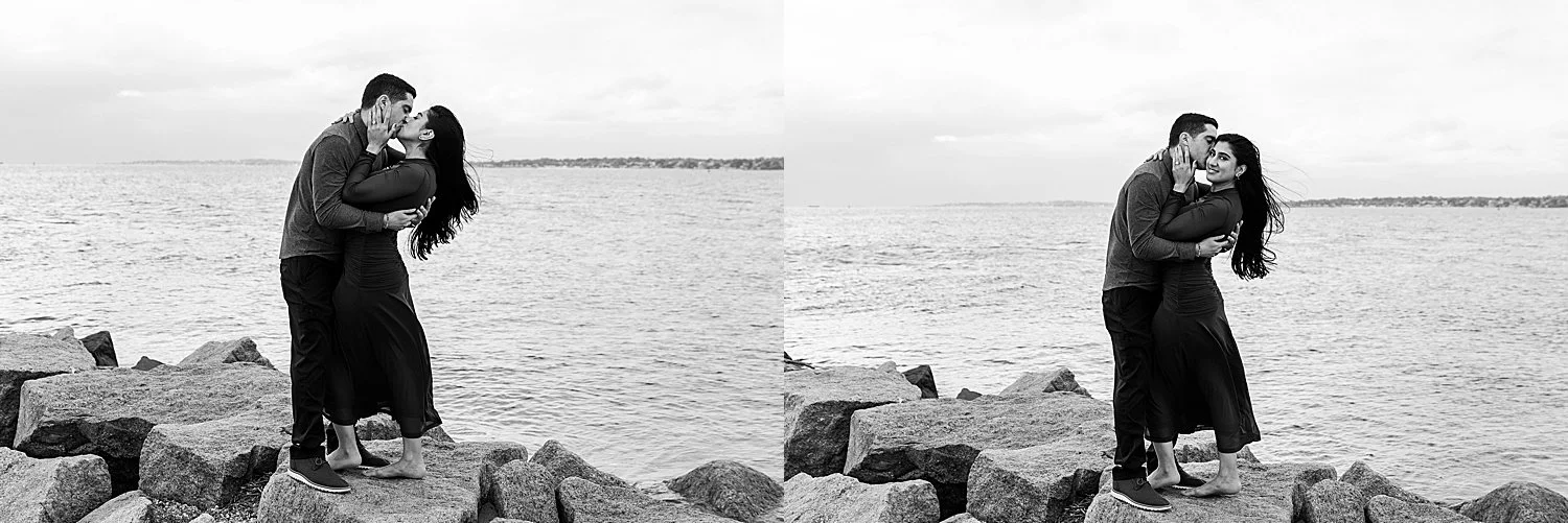 couple stands on rocky cliff in New Haven during engagement photo session