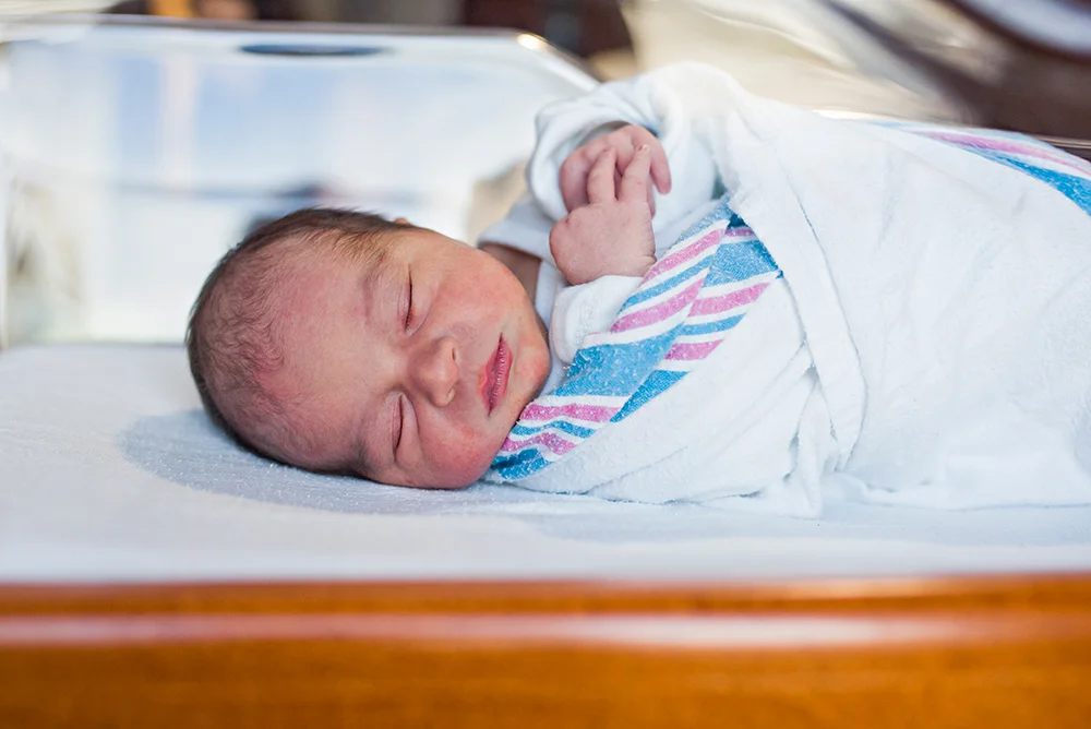 newborn baby in hospital blanket. CT newborn photography in the hospital.
