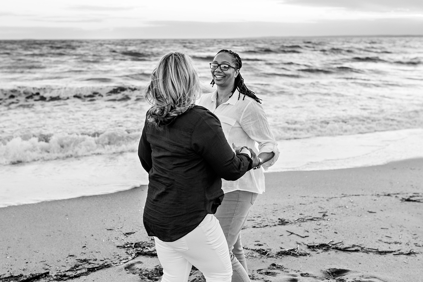engaged couple dancing on beach madison connecticut weddingphotography 