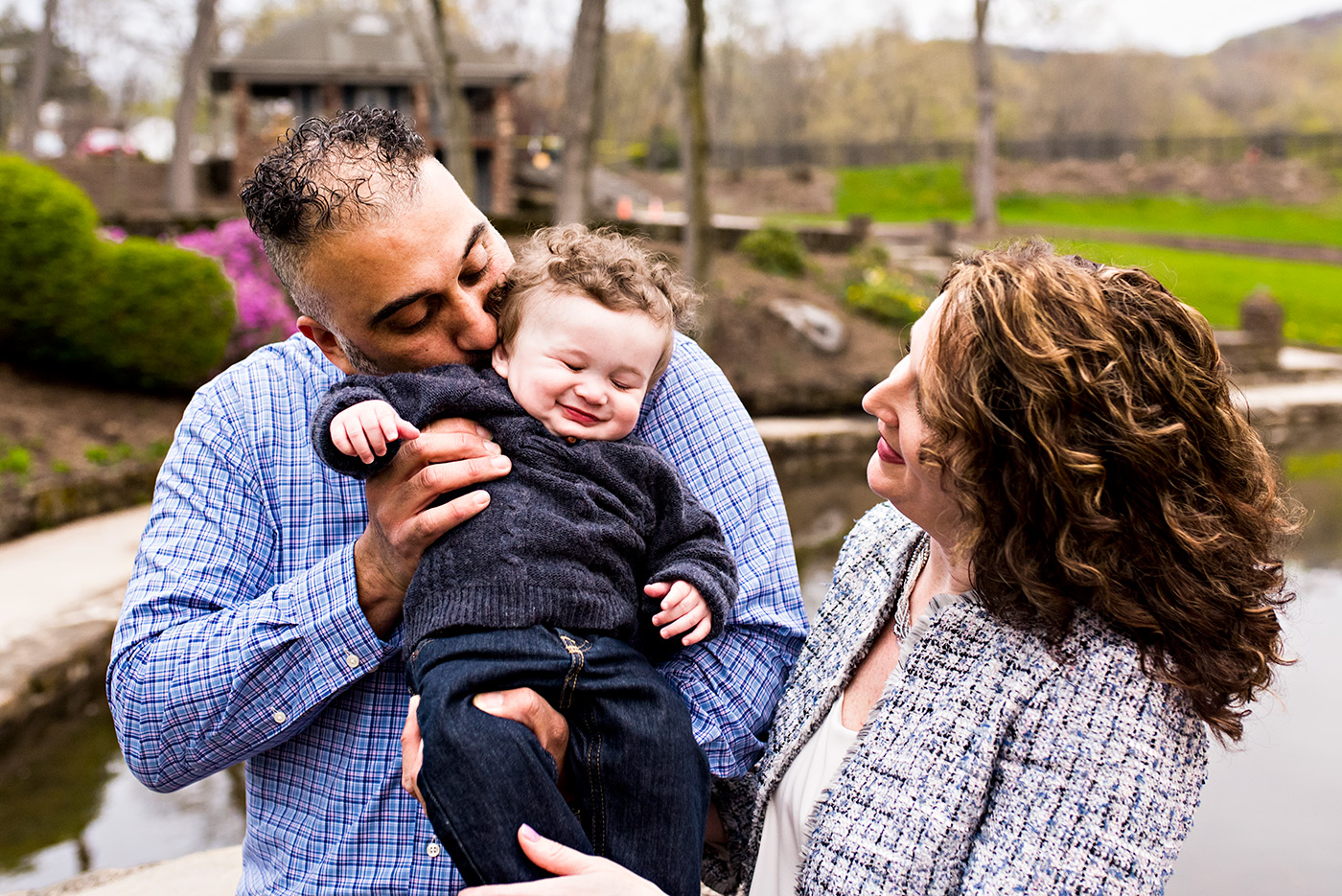 father kissing infant son's neck while giggling hubbard park meriden connecticut family photography