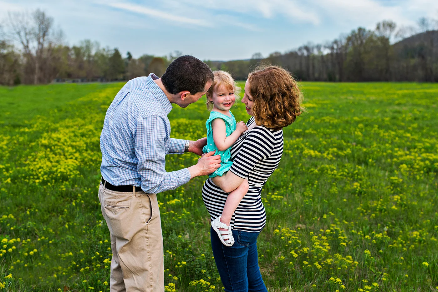 dad tickling daughter in field at haddam meadows in haddam connecticut lifestyle maternity photography