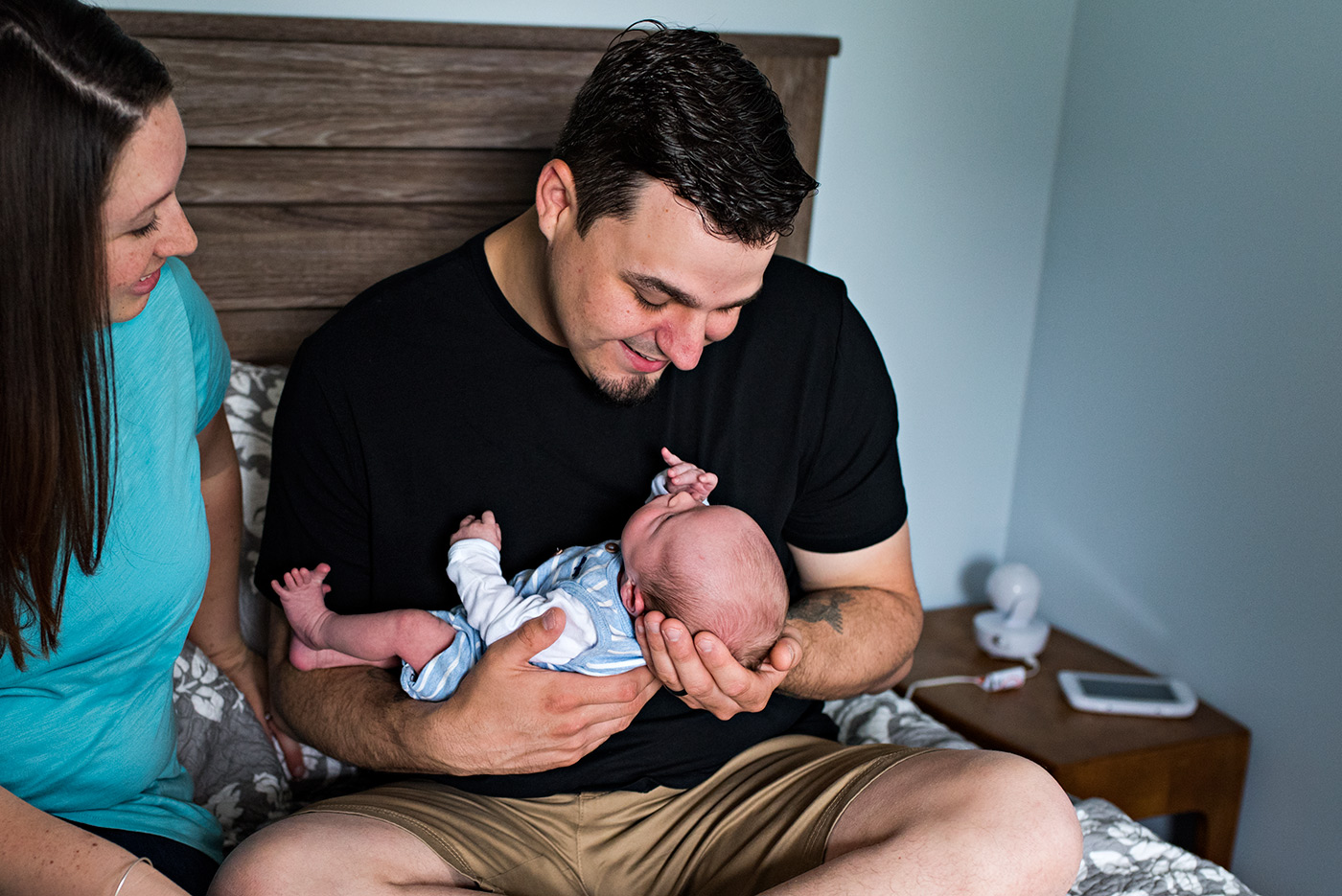 dad smiling at newborn son in his arms southington ct newborn photography